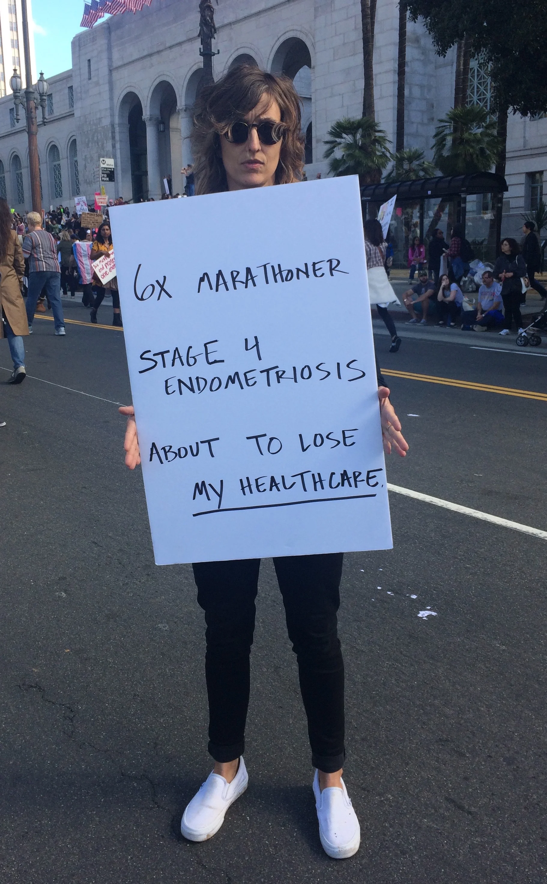 Anne Carson shared her story on the route to the Hall of Justice. (Photo by Loud Owl)