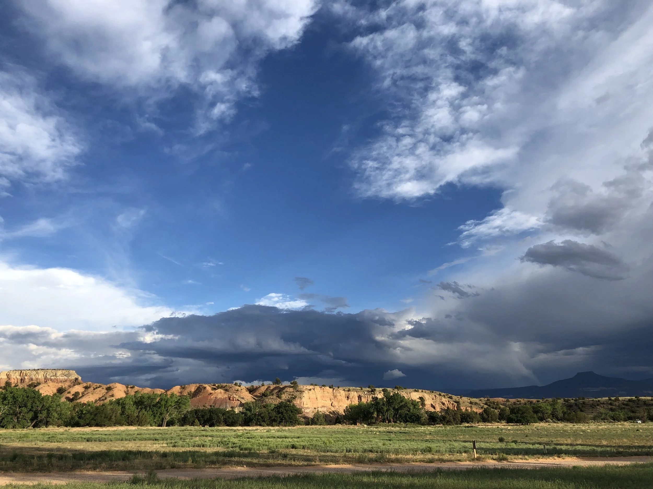 New Mexico field, mountains and dramatic sky