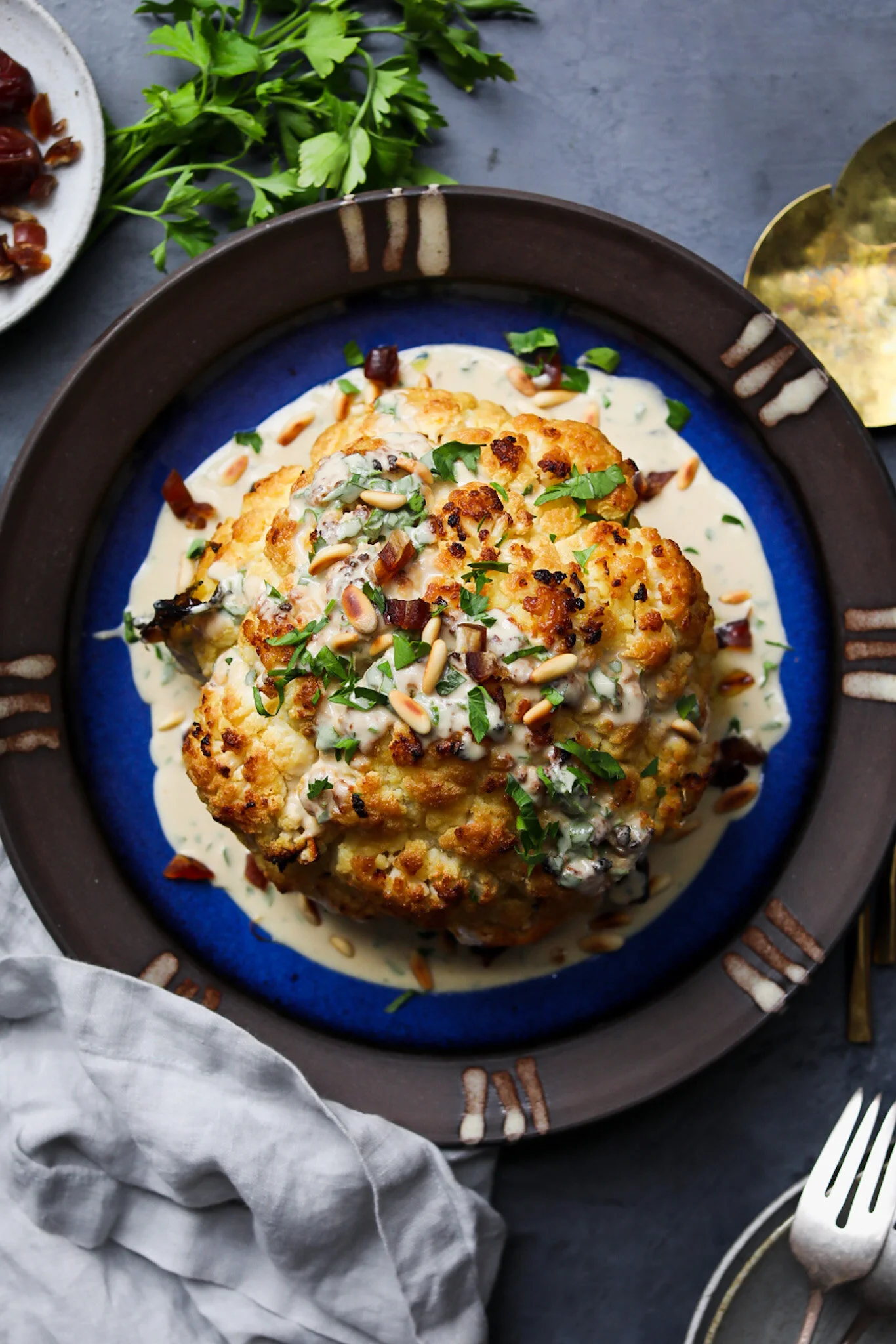 Whole Roasted Cauliflower with Dates, Pine Nuts, (Preserved) Lemon and