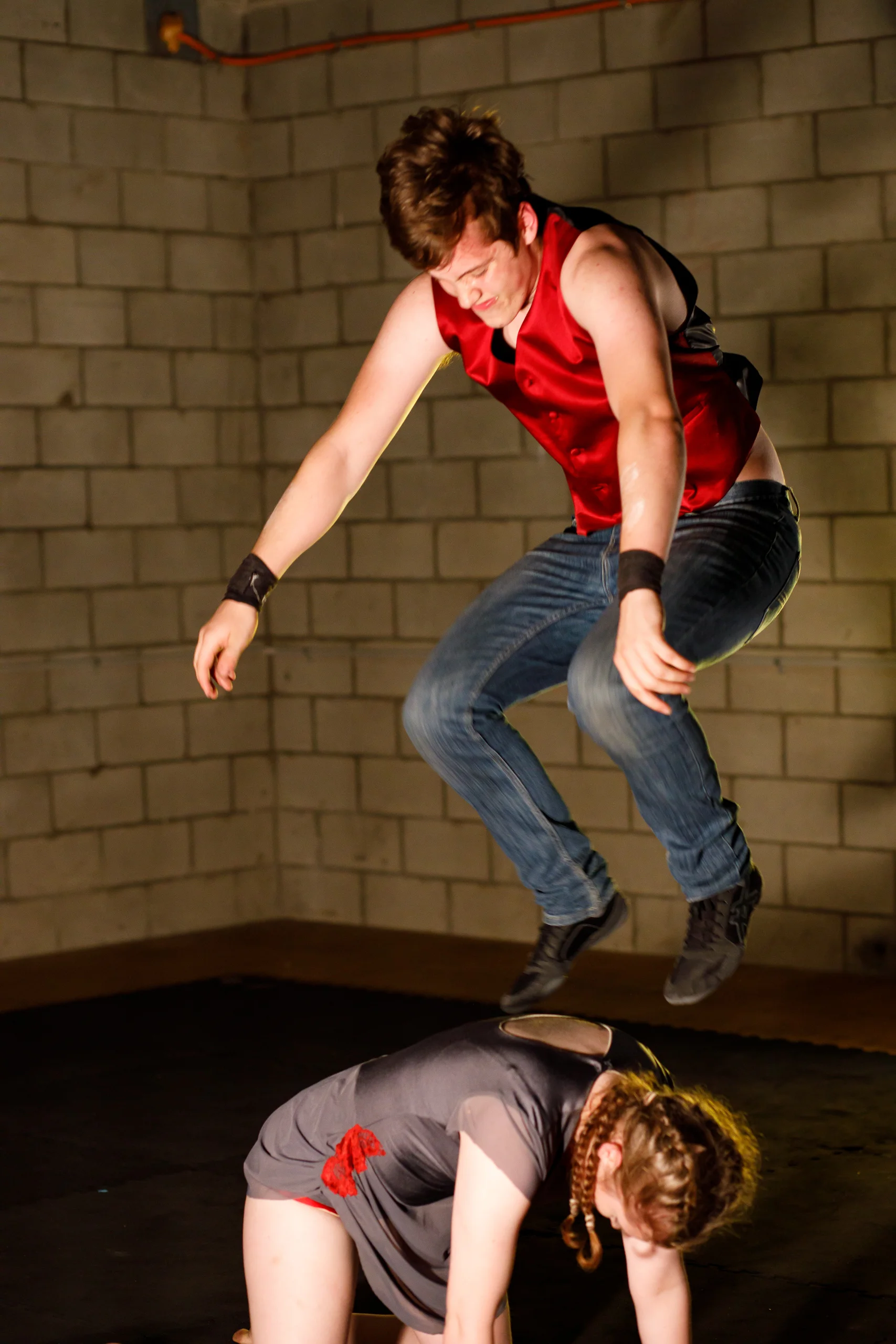 Pictured: Fin Casey jumping onto Megan Casey's back in Inertia: The First Law . Picture credit: Creative Futures Photography .
