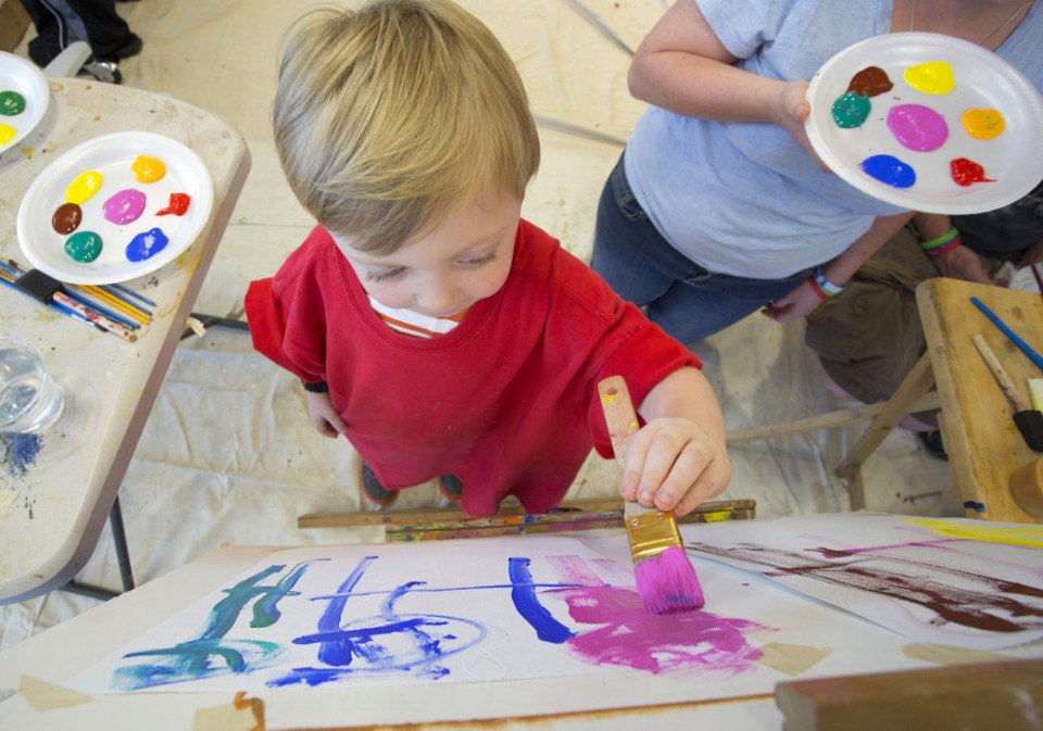 Evan Bonner, 3, works on a painting at USA Children's & Women's Hospital Wednesday, Sept. 25, 2013, as part of the Gifted Masterpieces program.