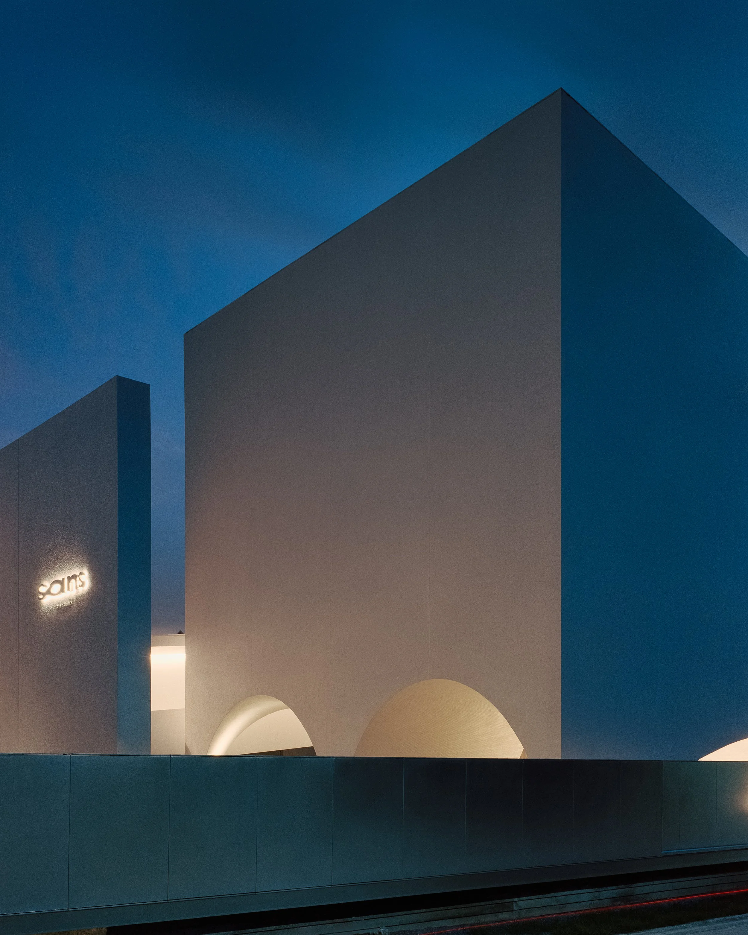  From the street, the land appears narrow and elongated, which influenced the shape of the building. However, by cutting into the mass of the structure, we were able to reveal its unique form and utilize the newly created voids for natural light. The