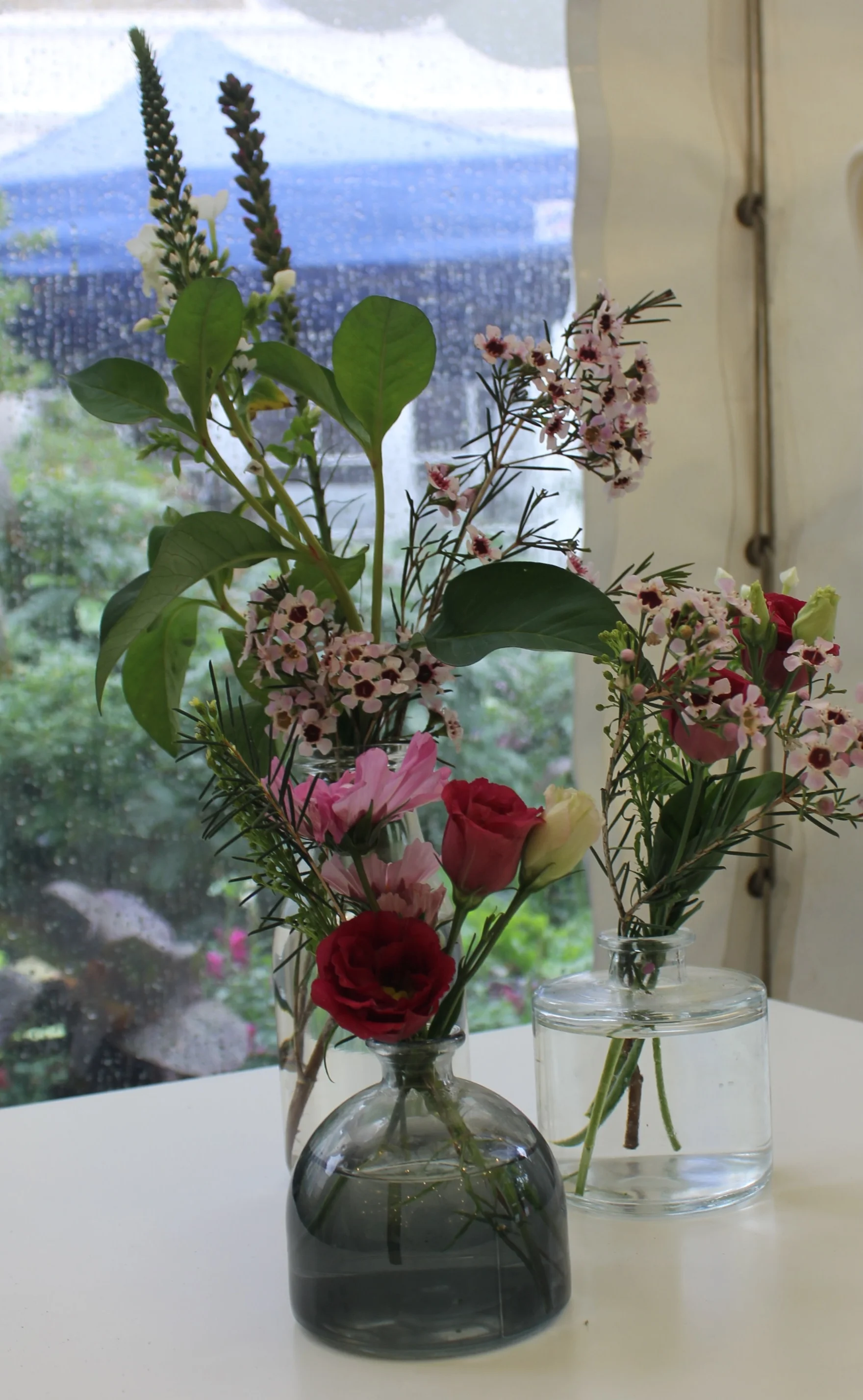 A variety of glass table vases in different heights and style. Please enquire for further information