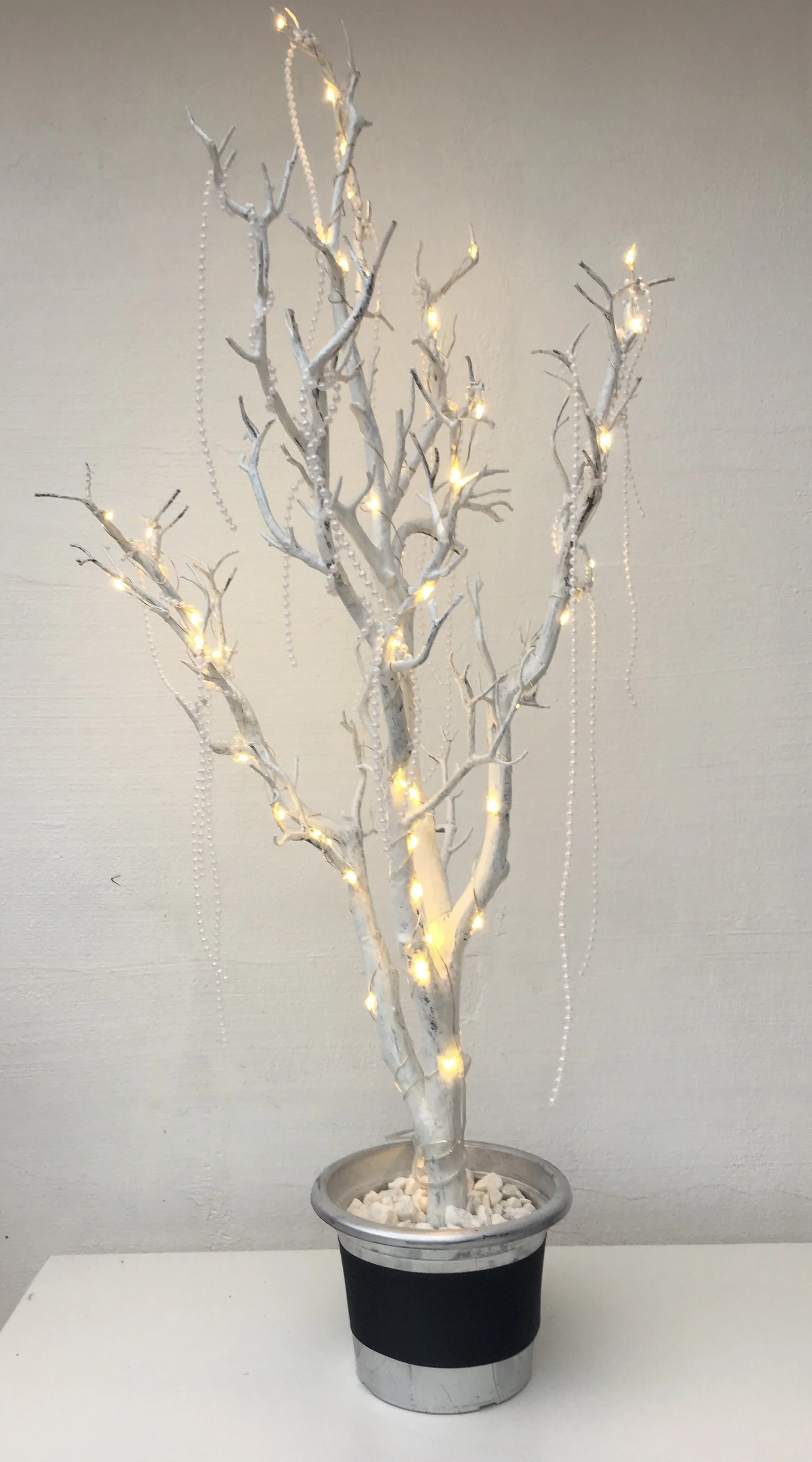 White tree centrepieces in silver pots. 14 available to hire. £18 each to hire