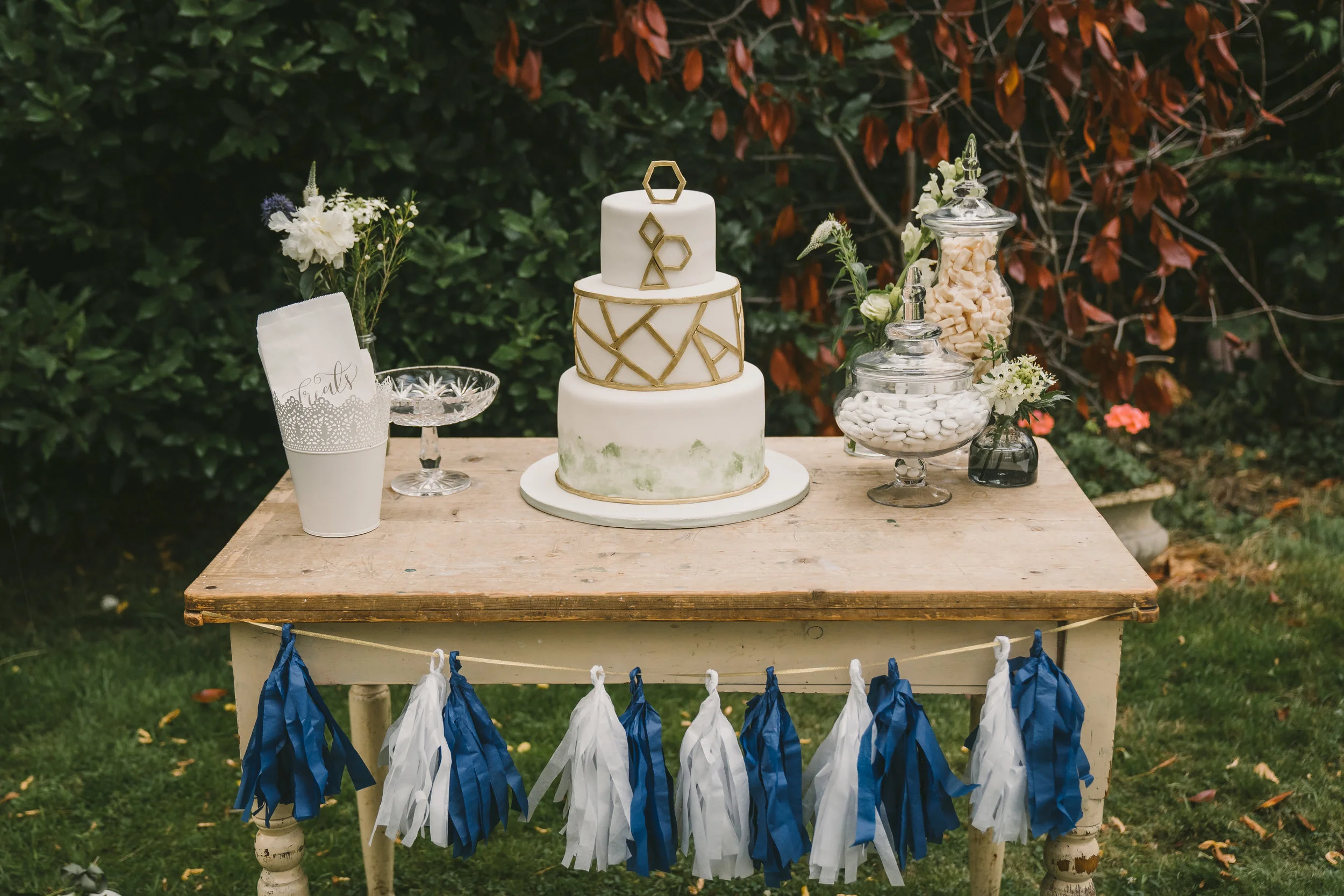 Vintage table for hire. One available £25. We can also create the tassel or ribbon garland
