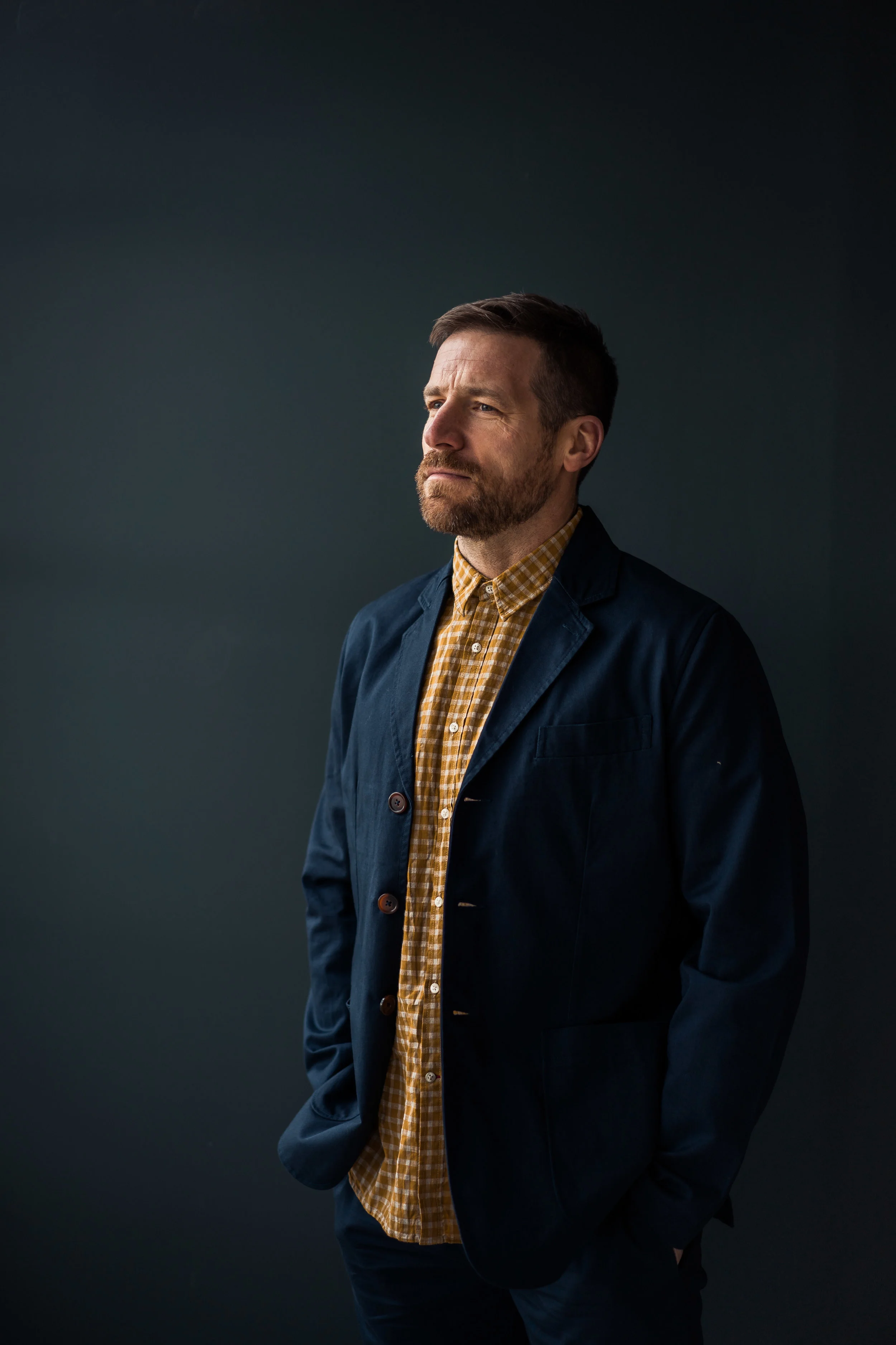 Blue suit in front of boards (1 of 1)-2.jpg