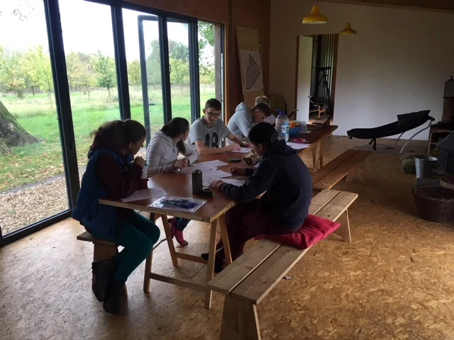 The second of the two groups completing their worksheets.