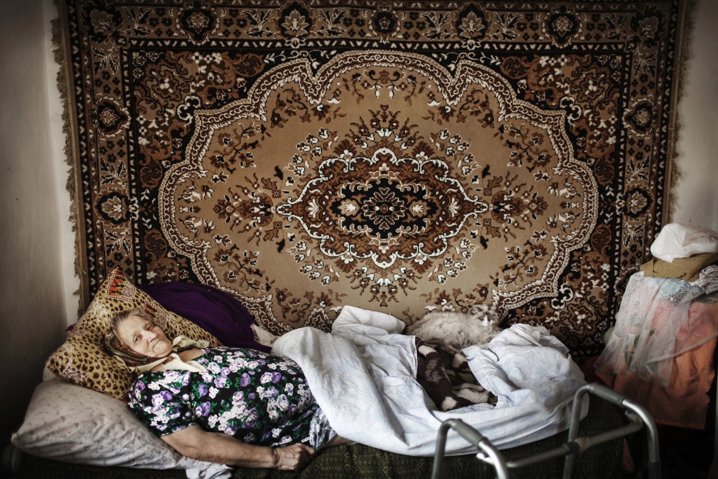  Olga is a so called resettler, who has returned to the Forbidden Zone, after the nuclear disaster. She is having a hard time to walk. For her 78th birthday she is wishing for better health. 