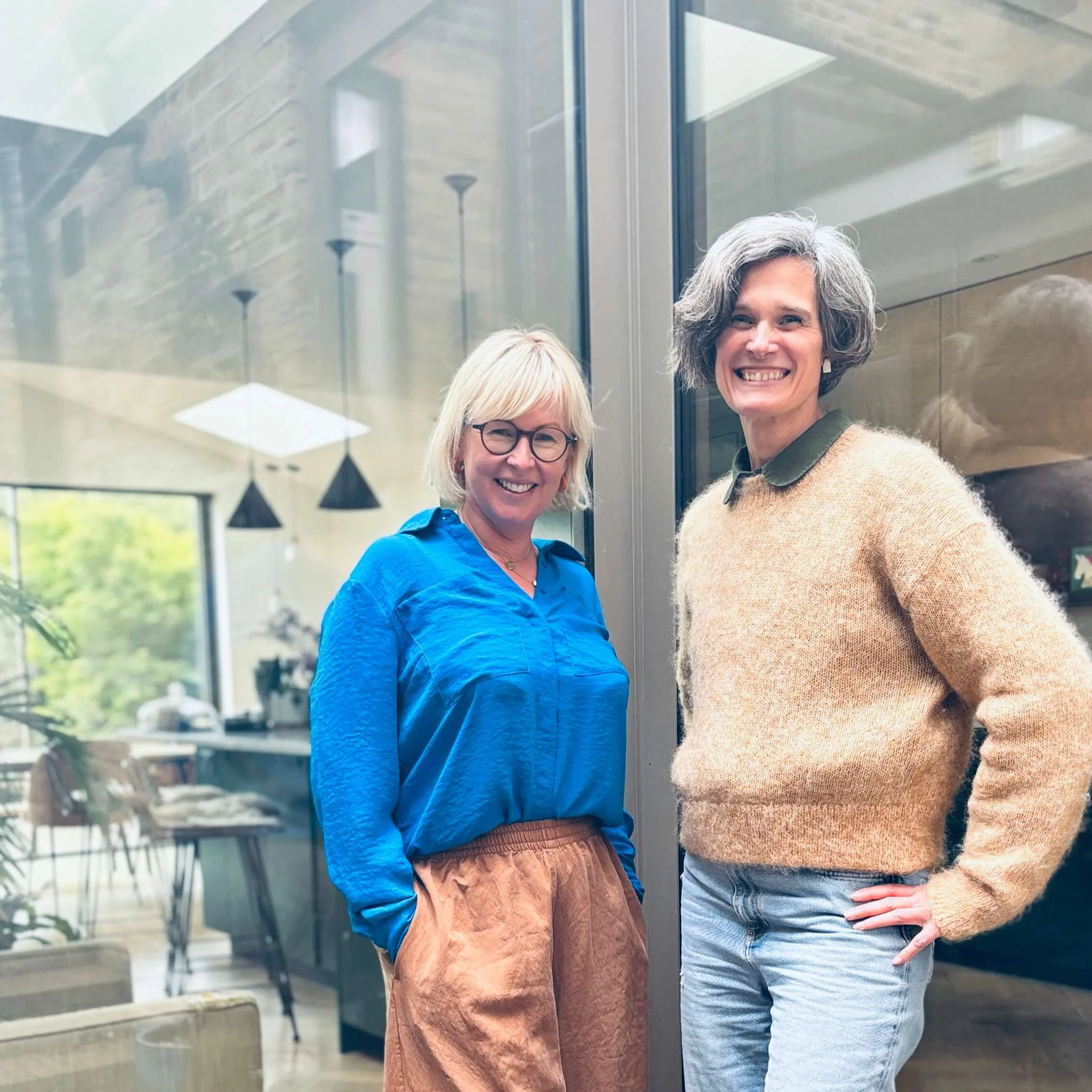 Two female architects outside a modern extension to a Victorian London home