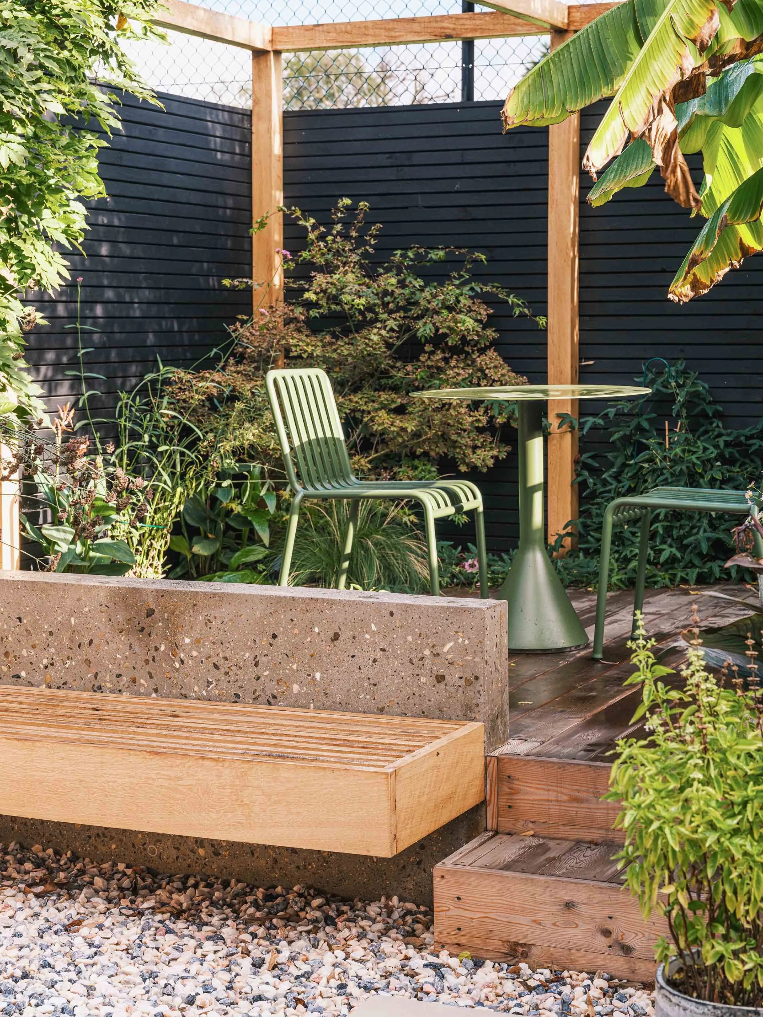 Concrete and oak bench in bespoke garden