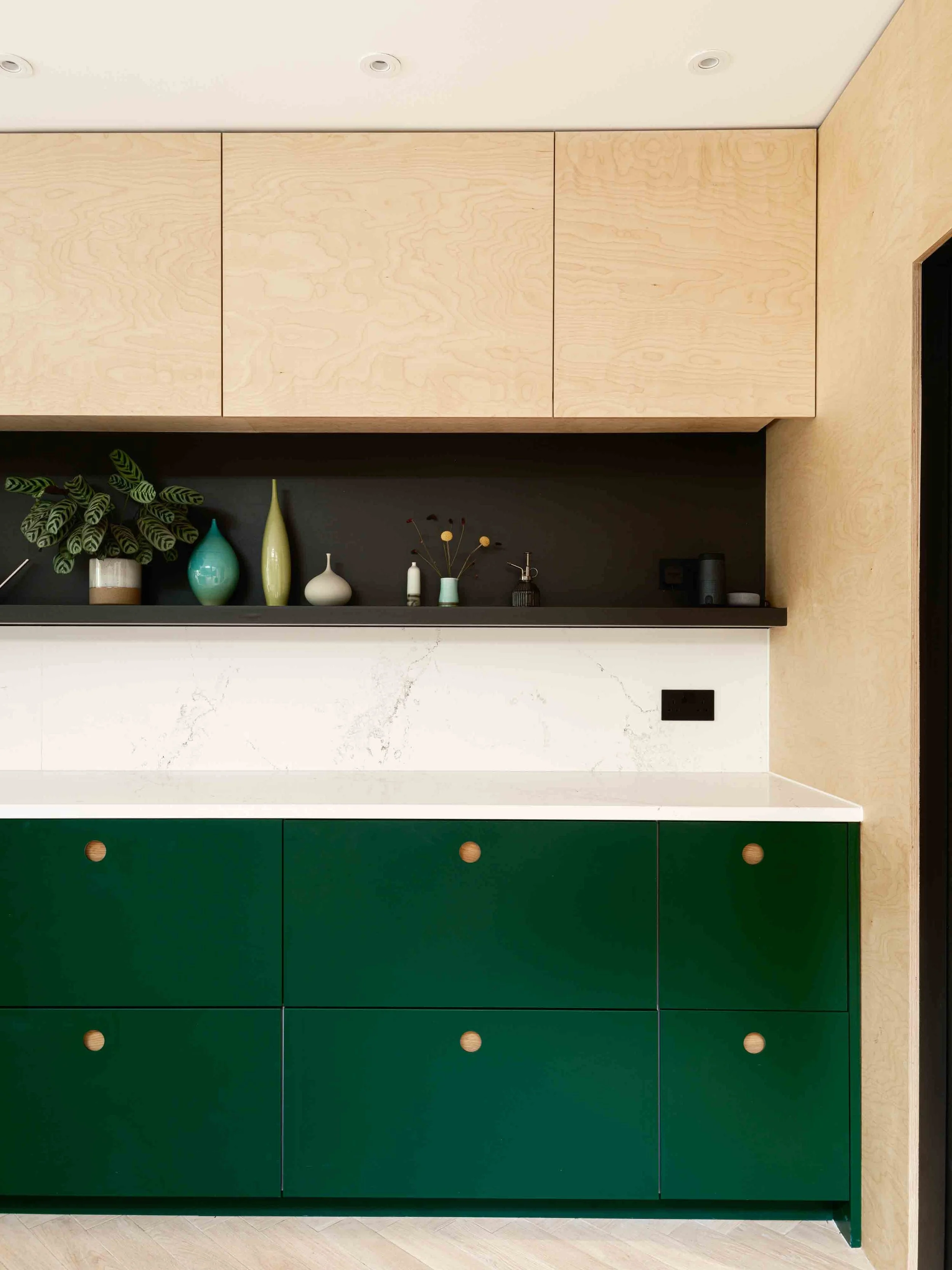 Hunter green kitchen with plywood cabinets