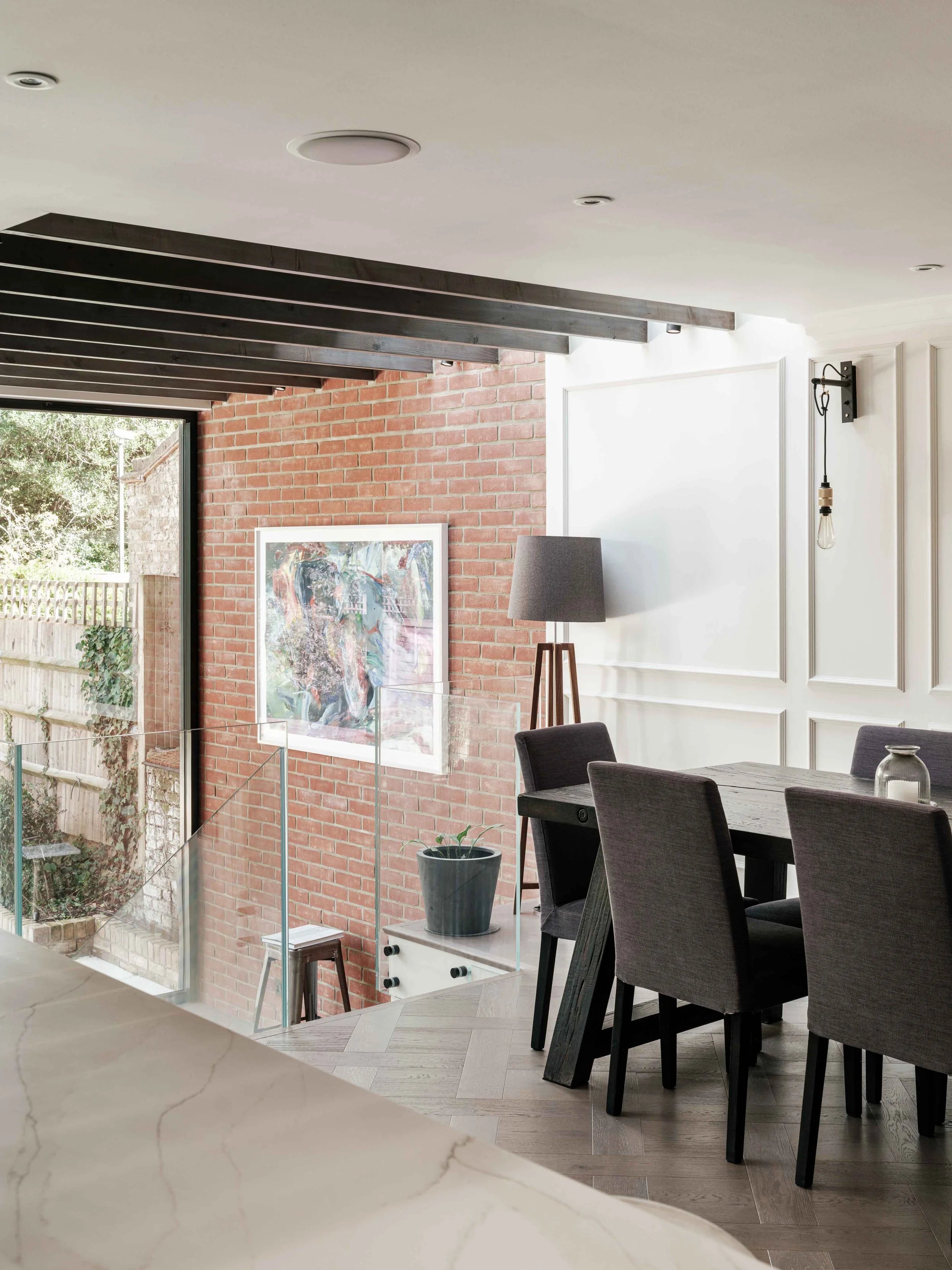 Split level dining room and exposed rafters