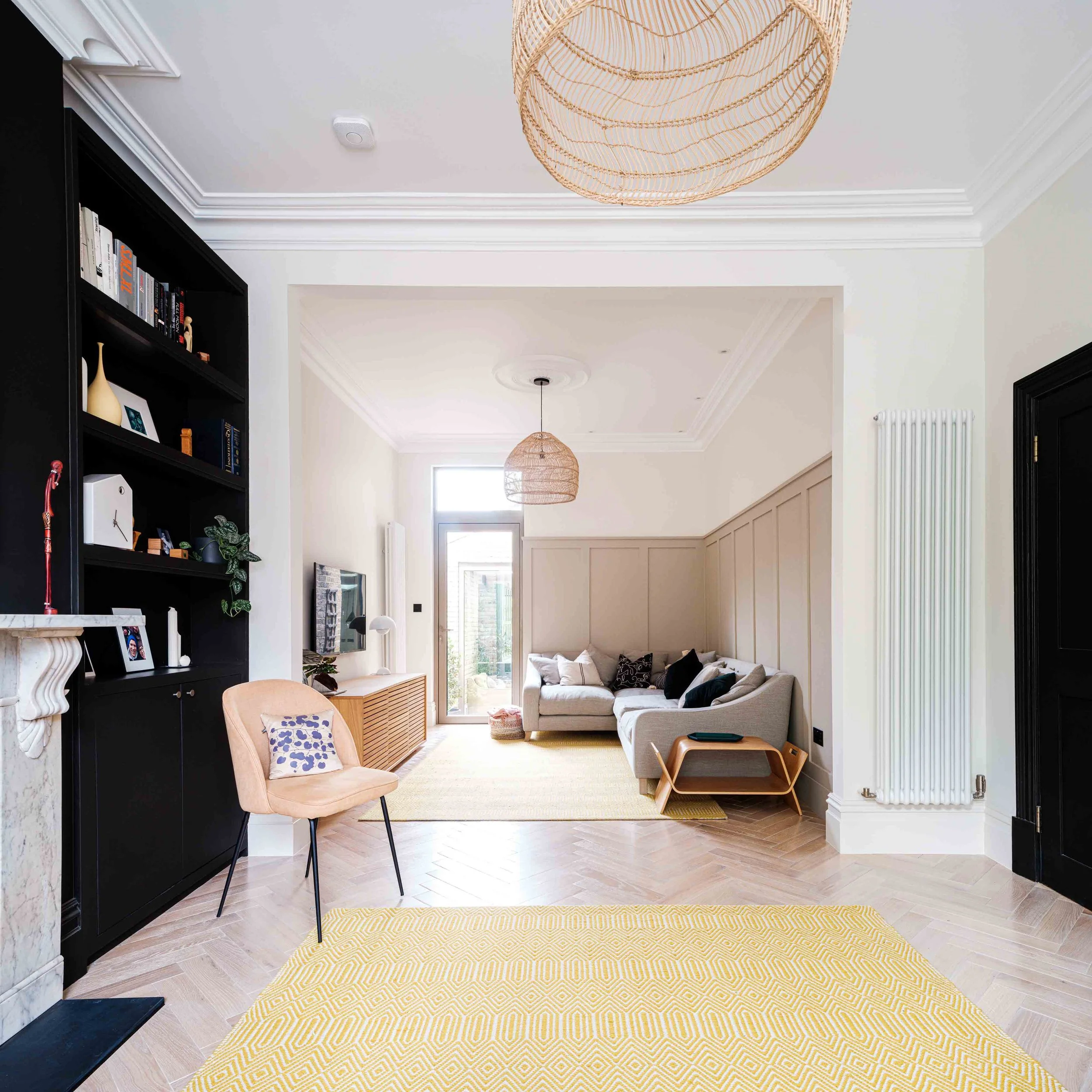 Pale oak herringbone floor in Victorian living room 