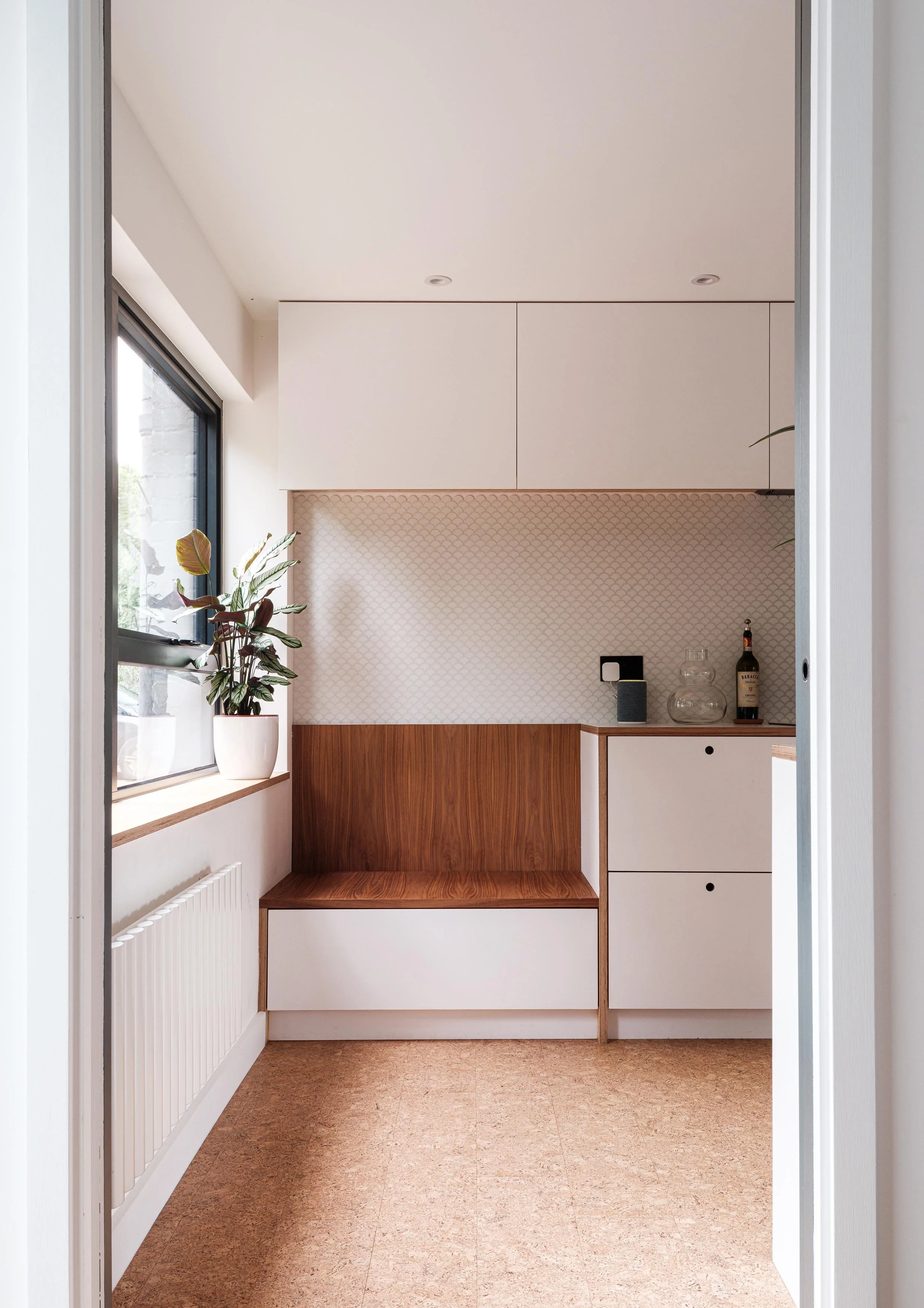Plywood bench seat incorporated into kitchen