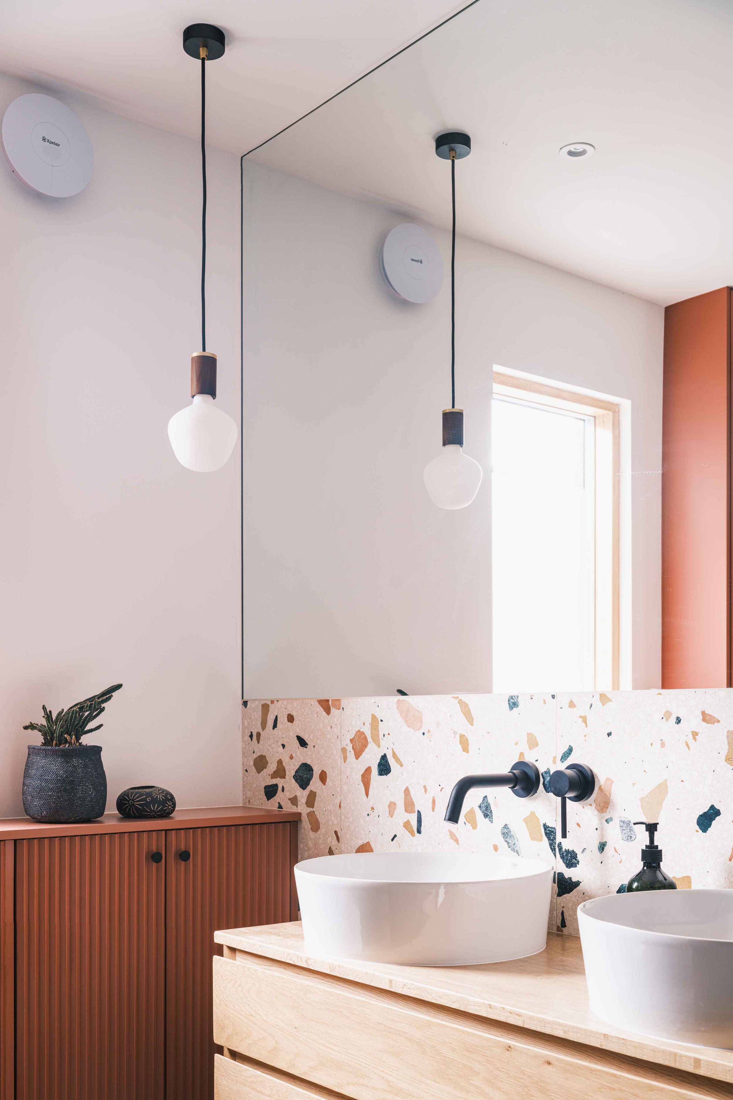 Terrazzo tiled bathroom with pendant light