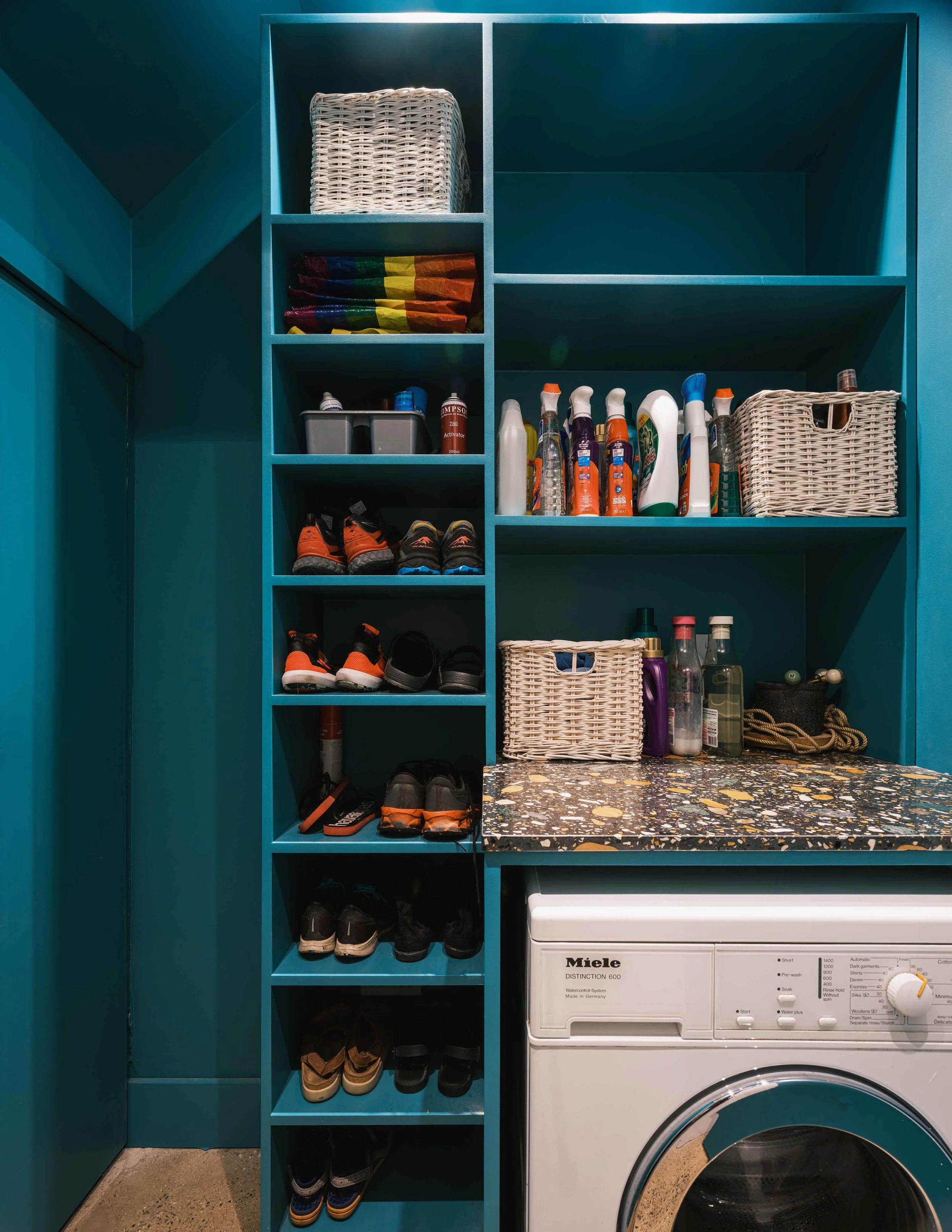 Colour drenched utility with terrazzo worktop