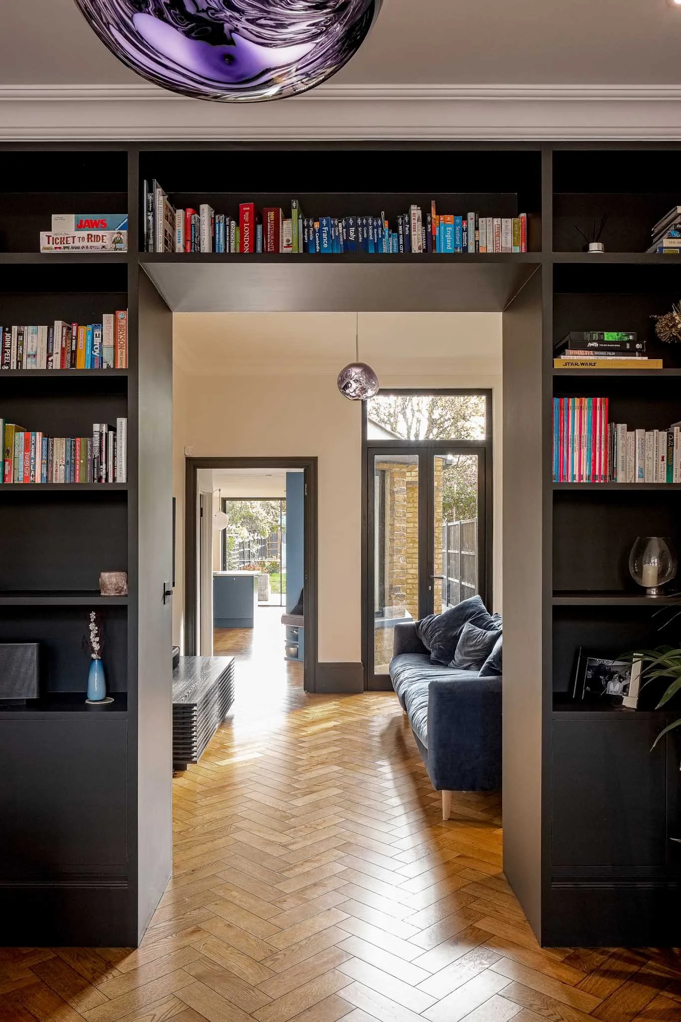 Bespoke shelving between separates living areas