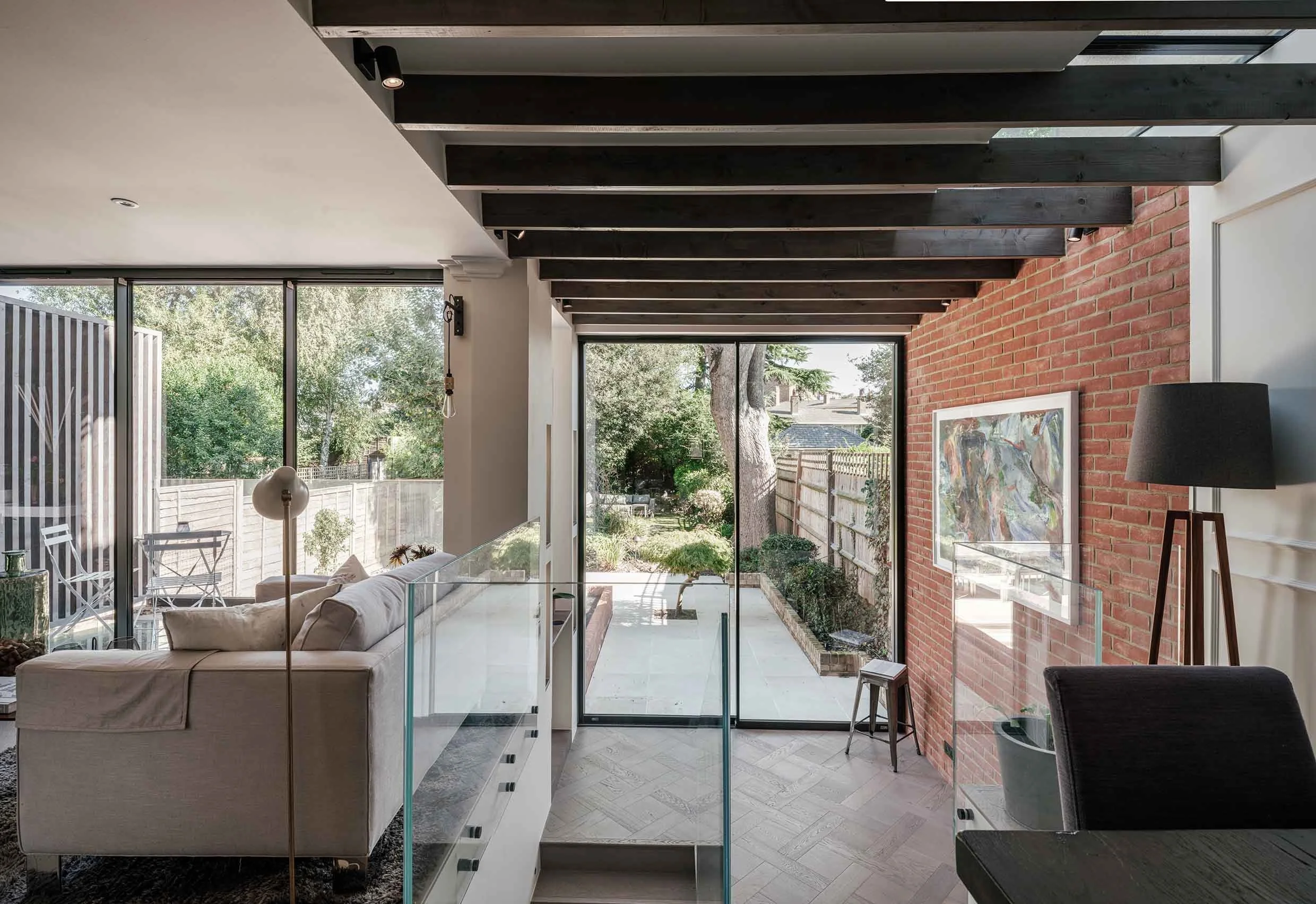 Split level living area linking garden