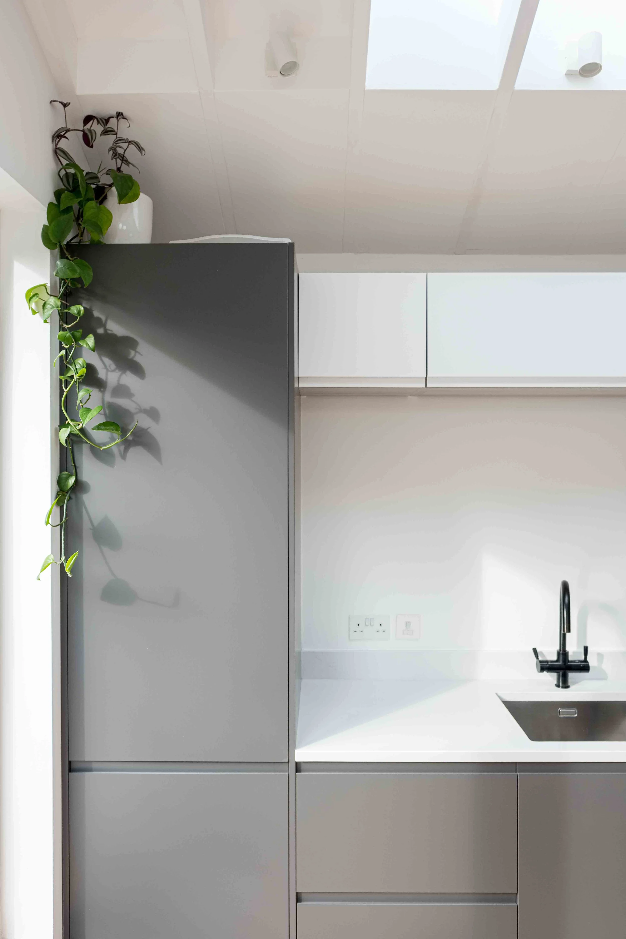 Understated grey and white kitchen with sculptural forms
