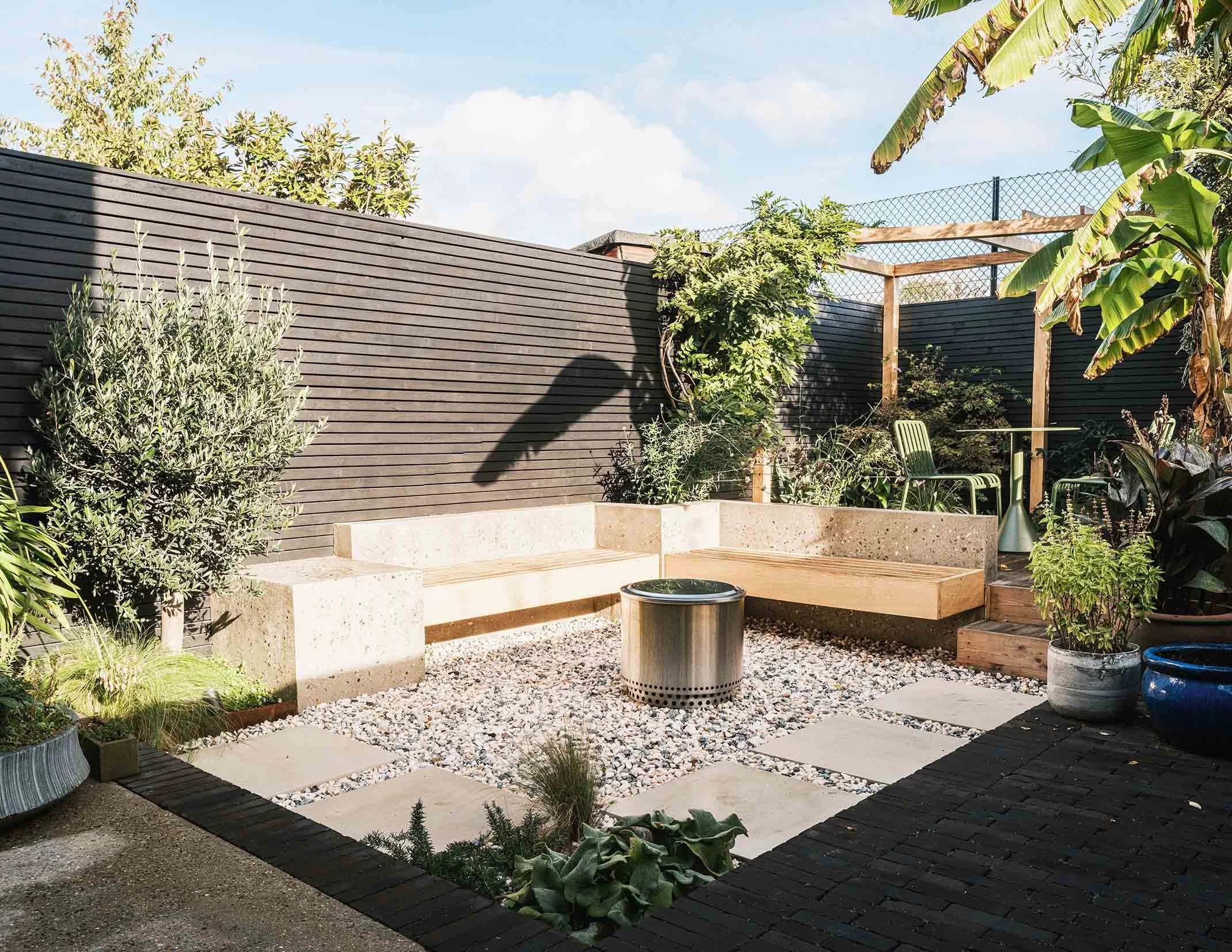 Bespoke concrete bench around gravel area with firepit