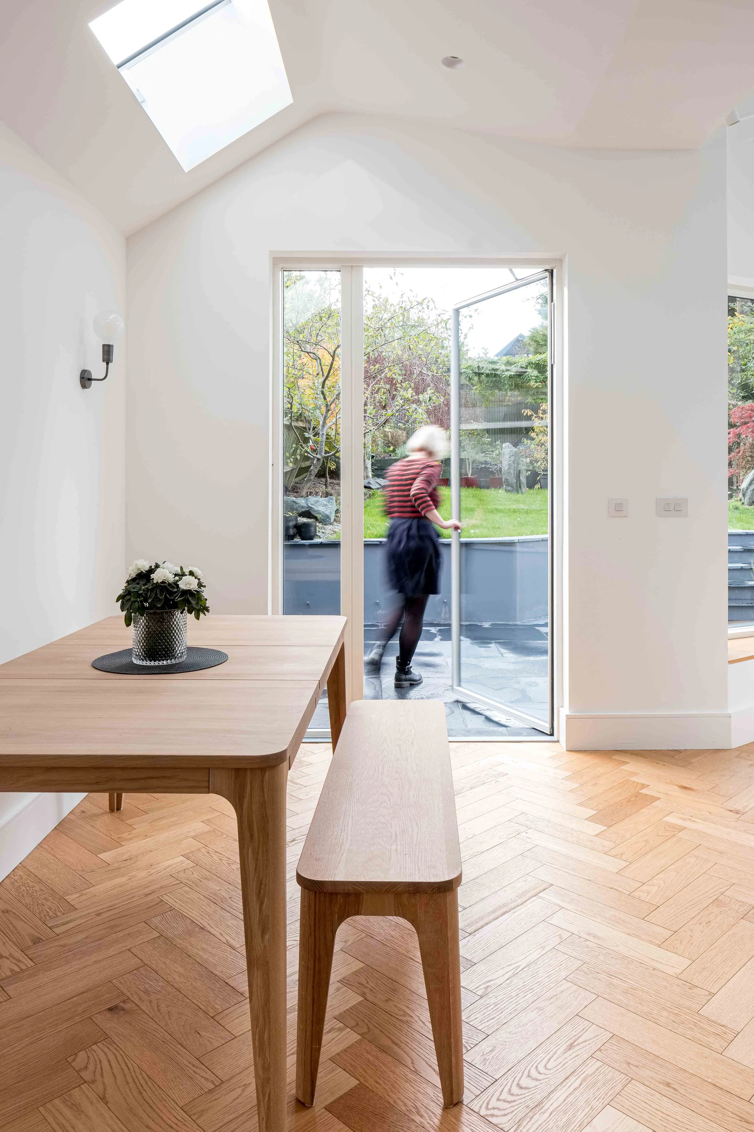 Dramatic vaulted ceiling leading into garden