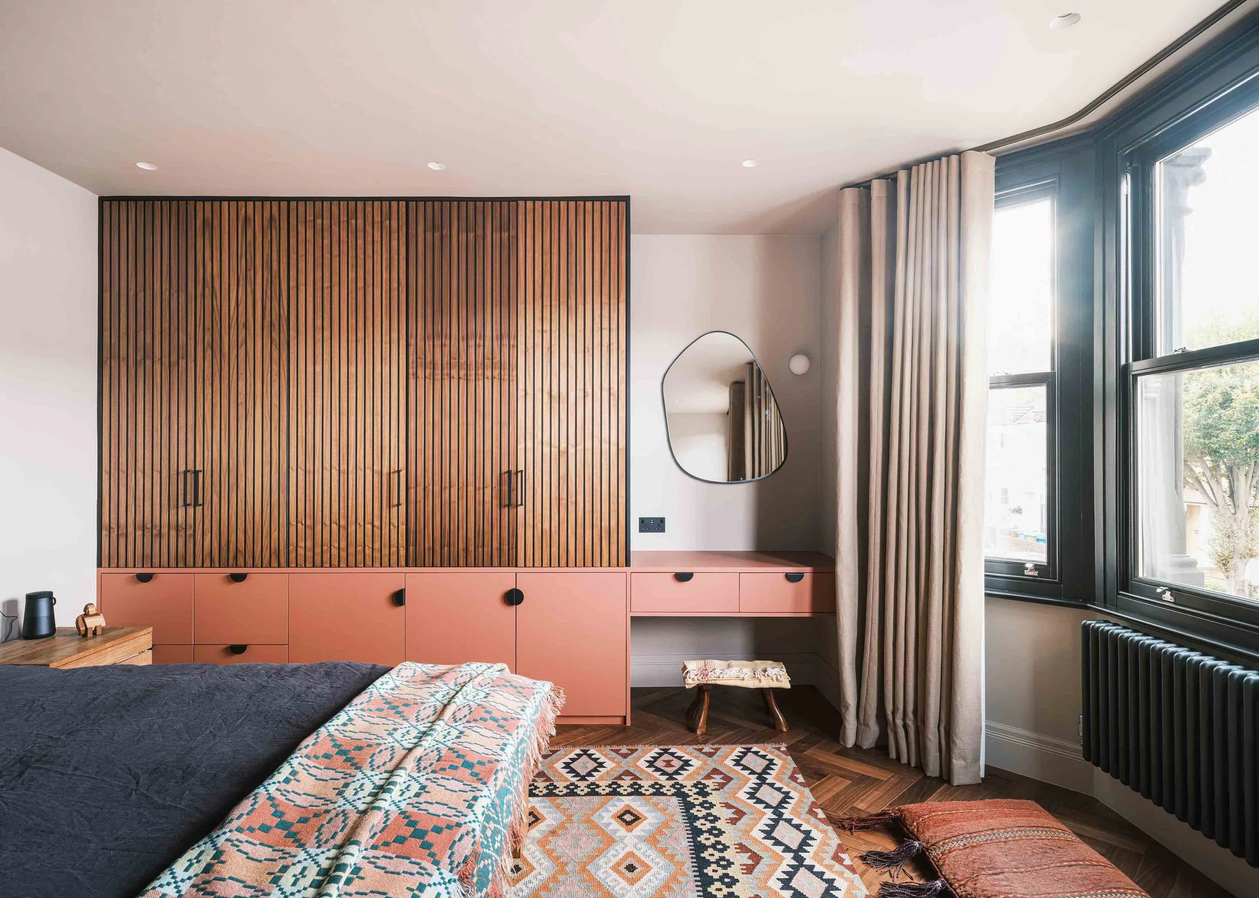 Bespoke wardrobes in terracotta, taupe and walnut