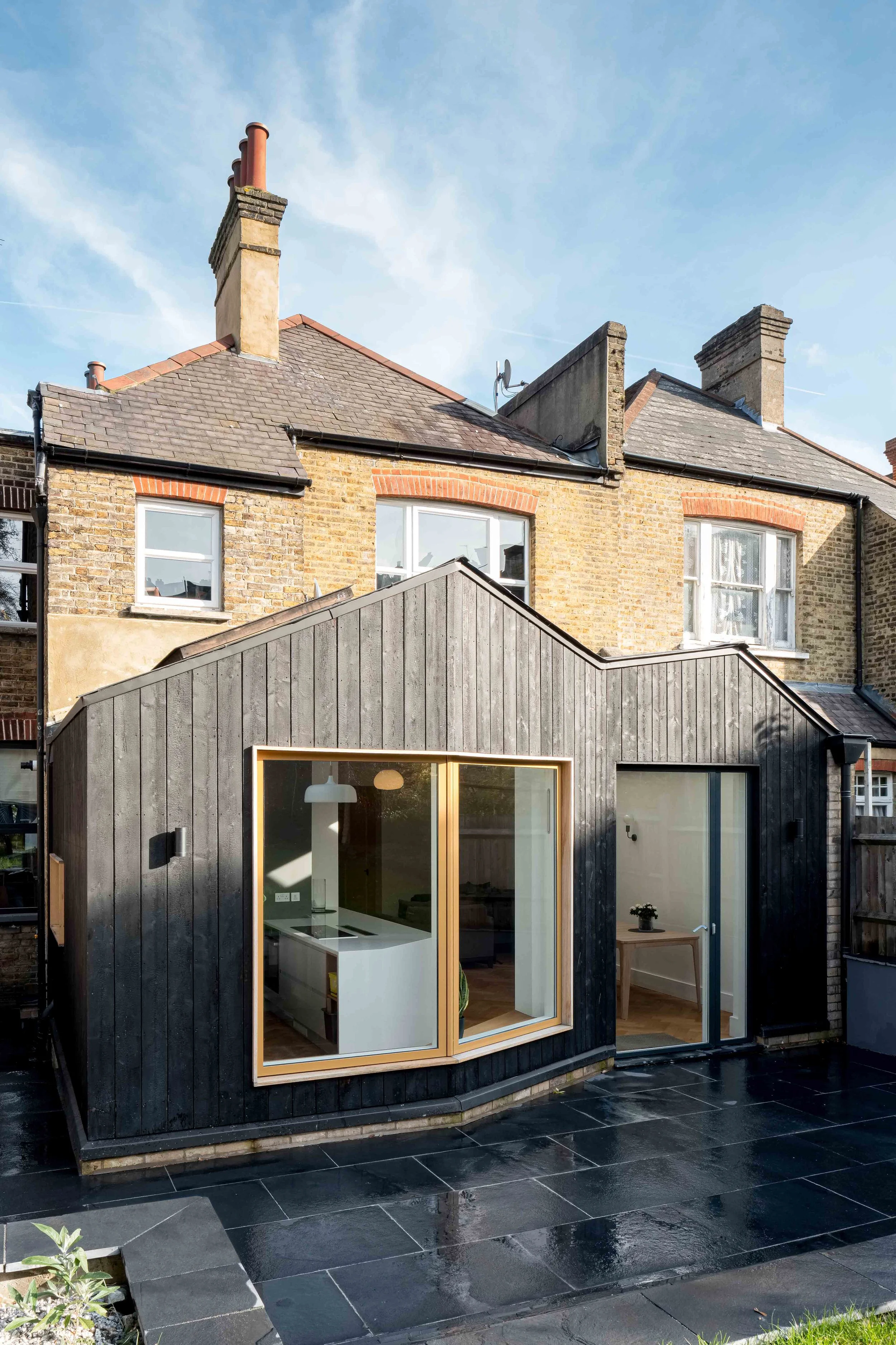 Rear extension to a Victorian flat in Forest Hill, clad in charred larch with oak-framed windows