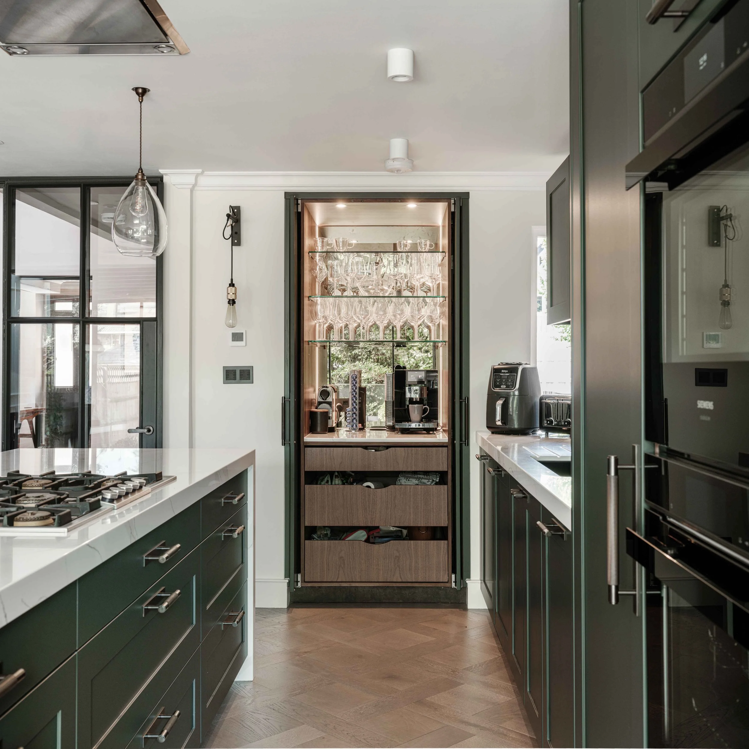 Light filled kitchen with concealed bar storage