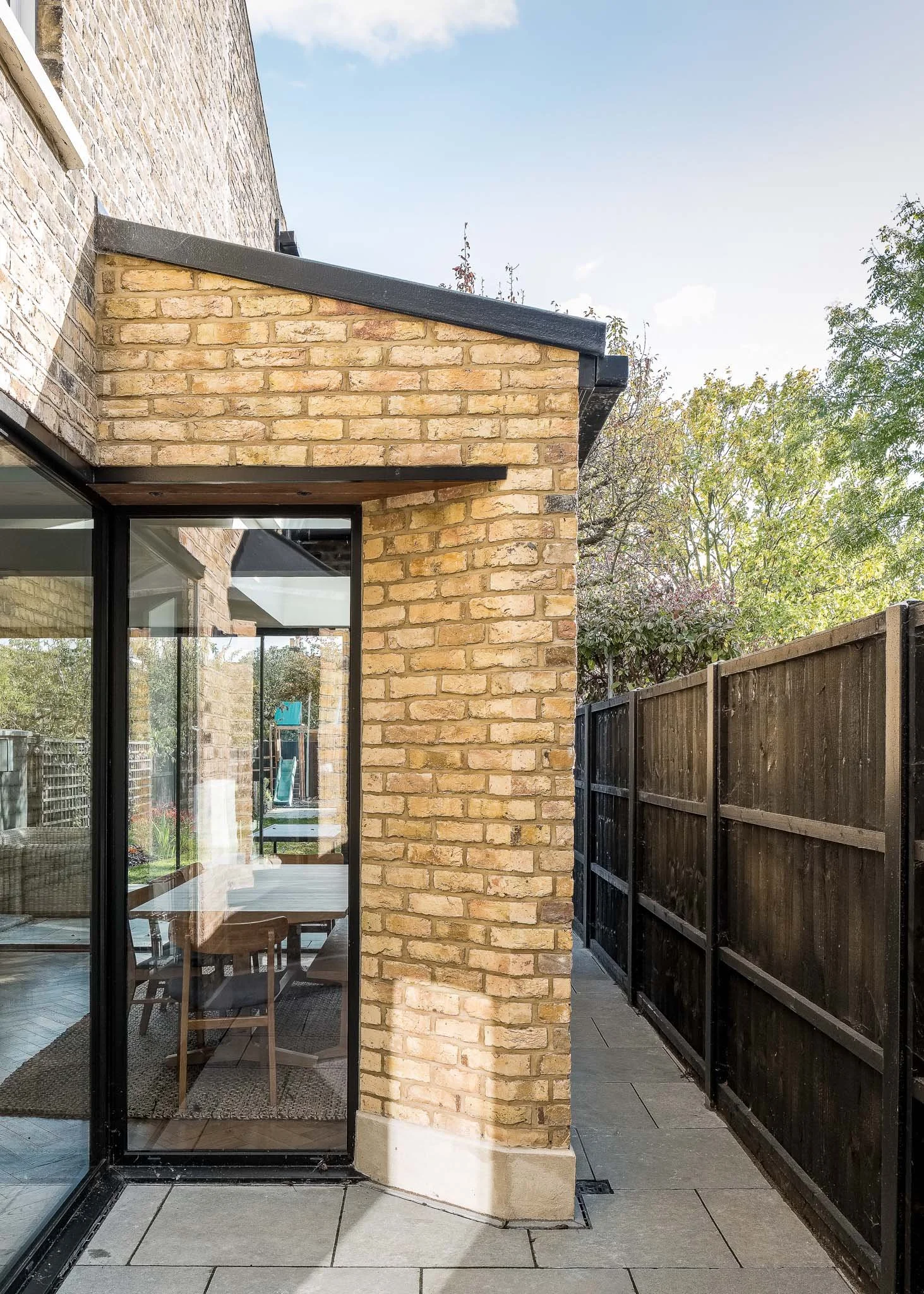 Deep angled brick reveal and corner window