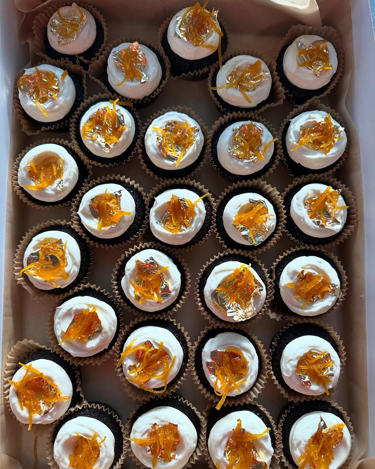 Guinness cake, cream cheese frosting, candied orange and gold leaf