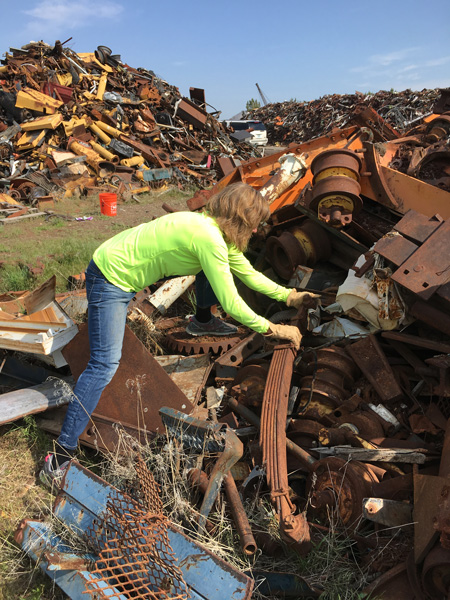 At the scrap yard! We are fortunate to have Swift & McCormick metal scrap in Terrabonne, not far from Bend. Rochelle hunting for treasures.