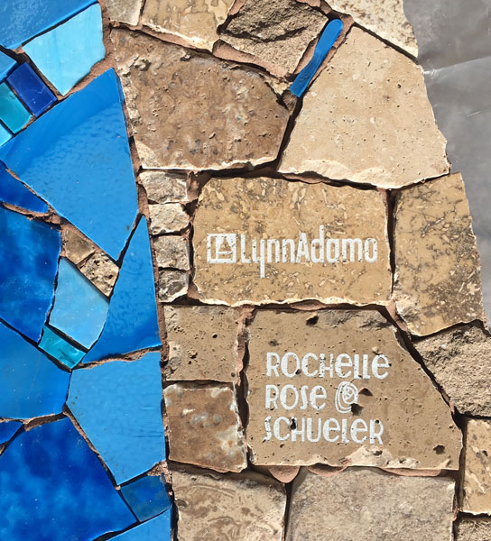 Our signature tiles, set in the bottom right of the work.