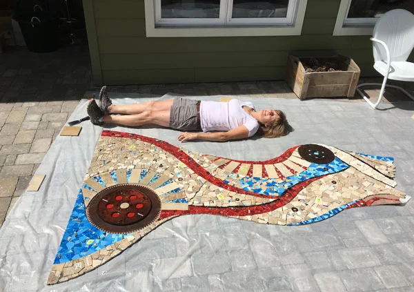 It’s over six feet! Rochelle having fun laying down next to to the work for scale.
