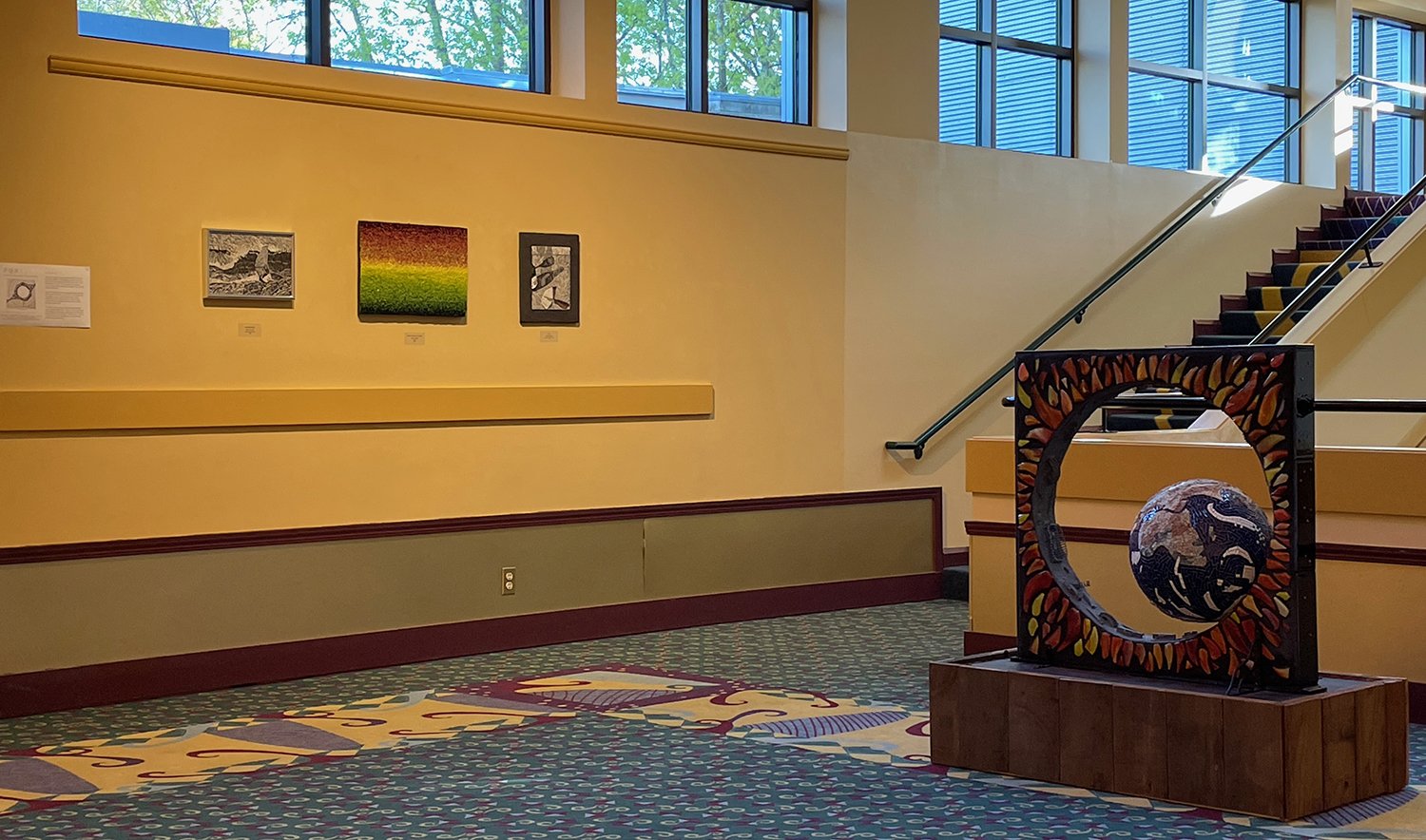  on the wall, L-R,  Richard Davis, Scott Fitzwater and Richard. Standing sculpture by Mark Brody. 