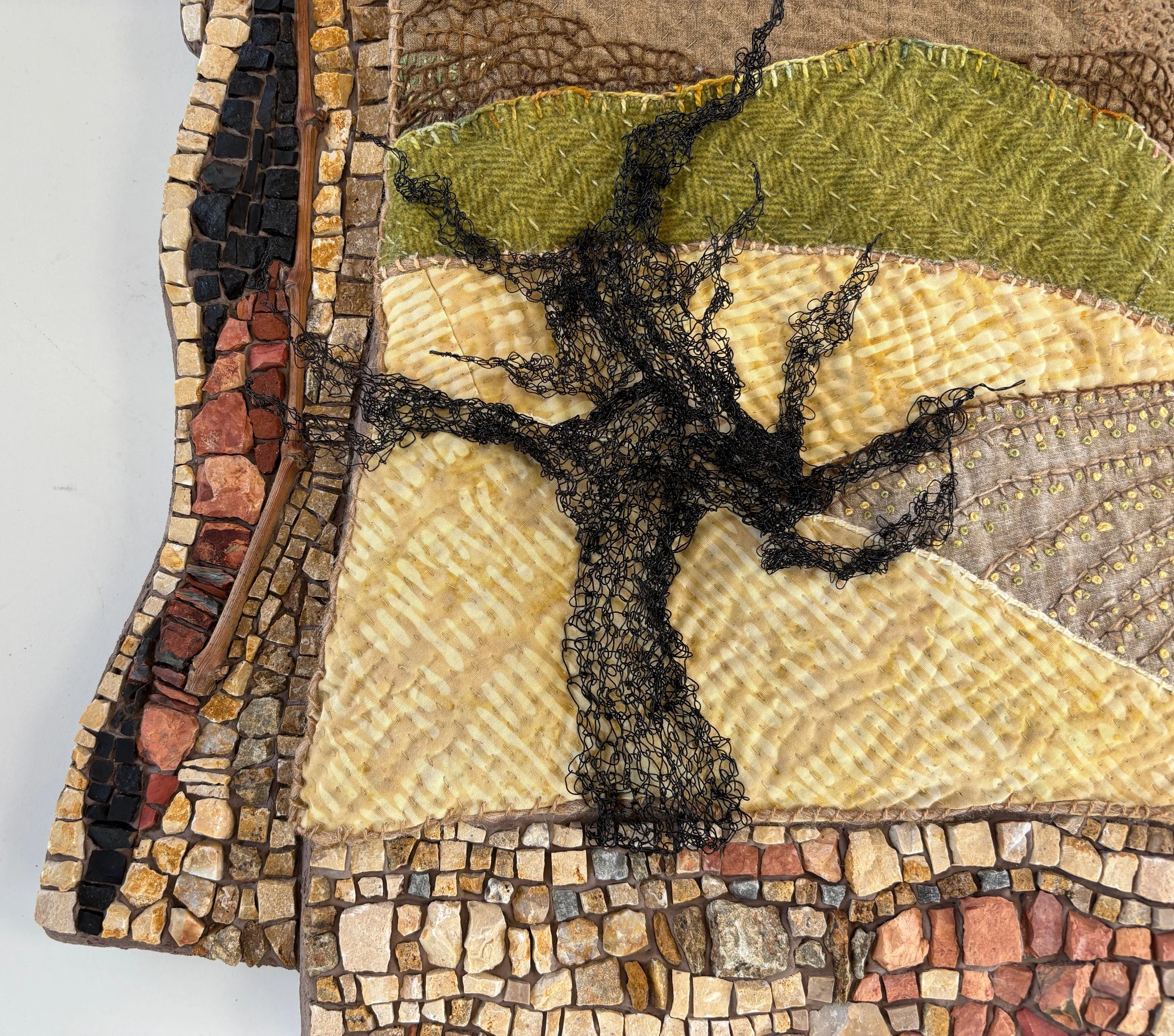  Detail 2.   I knit fine black wire to form a sculptural dormant old grape vine and affixed it to the stitched landscape.  