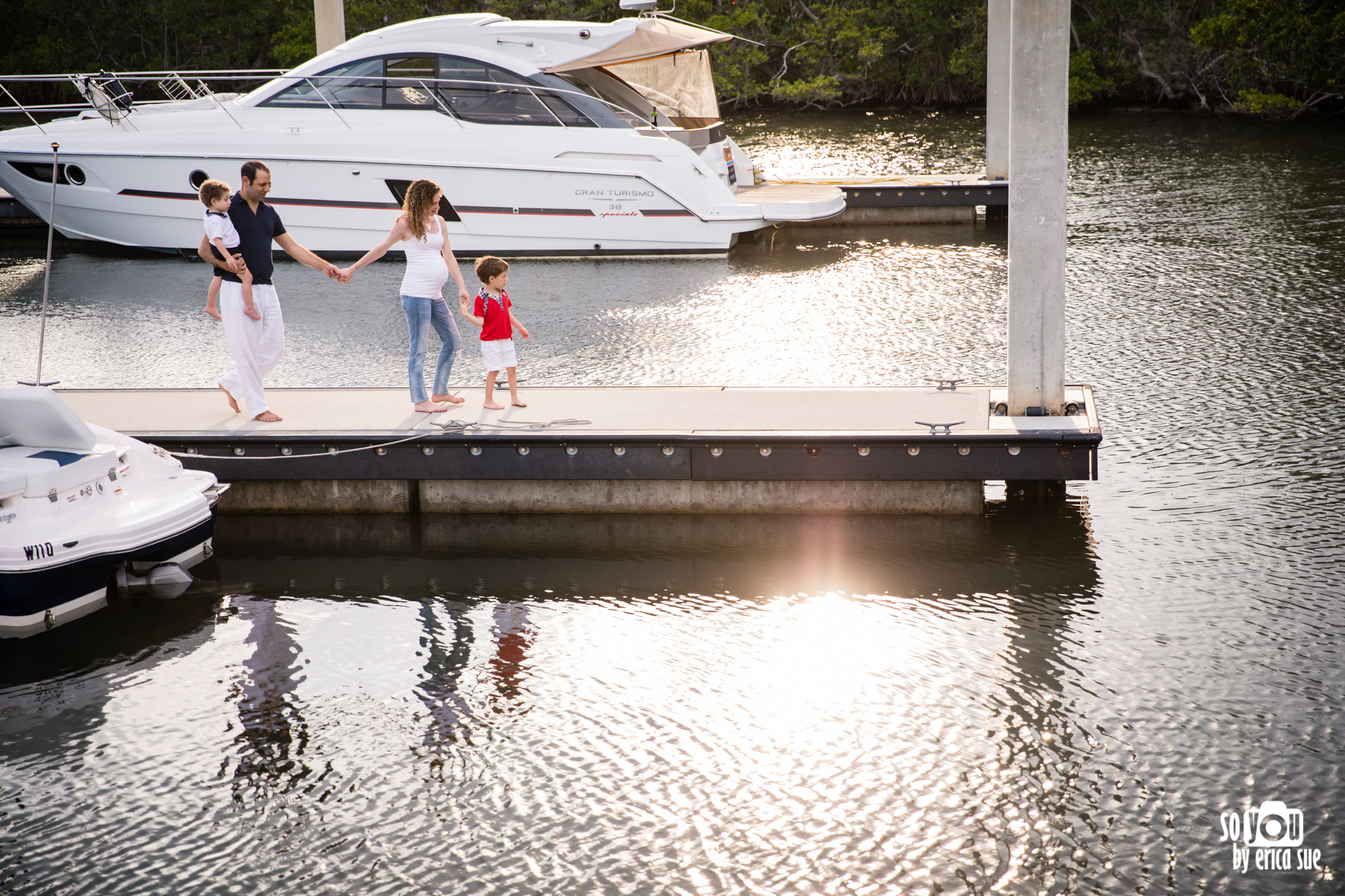 candid family photography boat dock