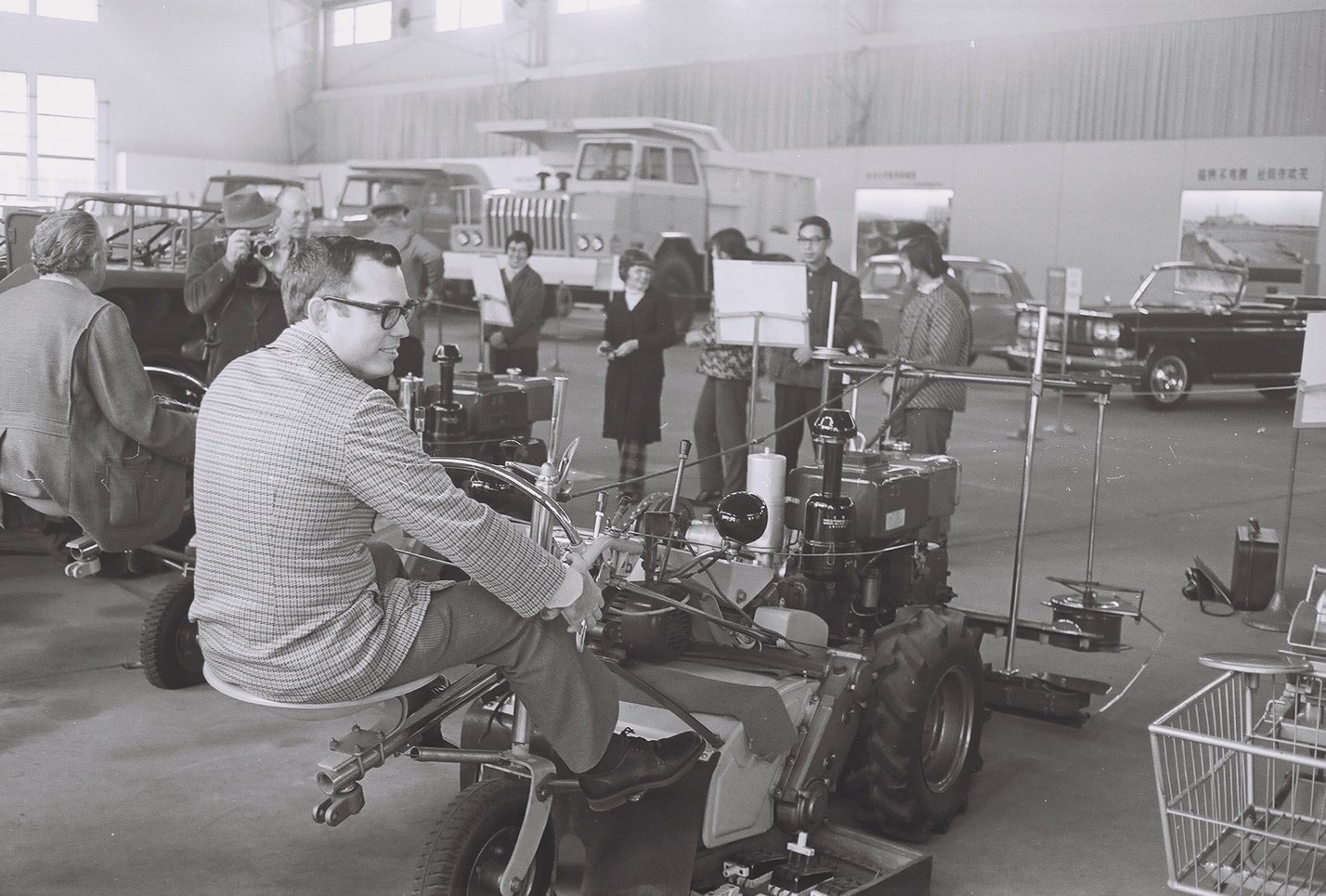  Roger Blobaum sitting on a small tractor in China. 1975 
