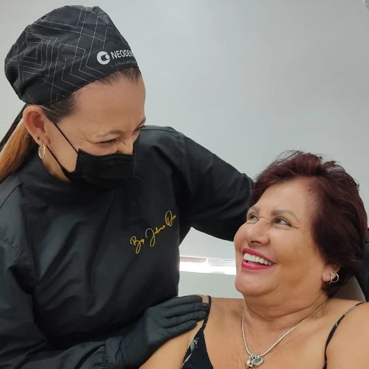 Patient after porcelain veneer treatment in Medellín, Colombia