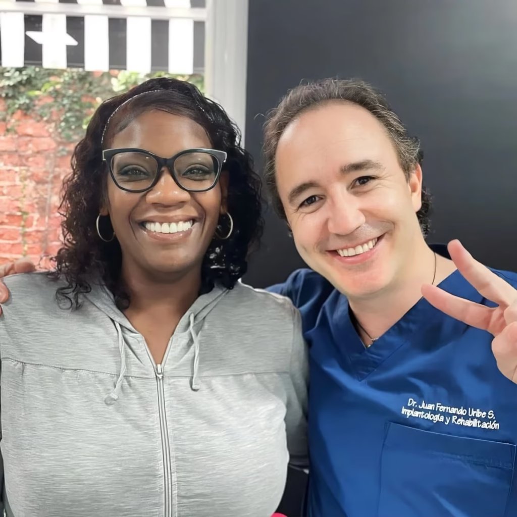Cali Dentist with happy international veneer patient