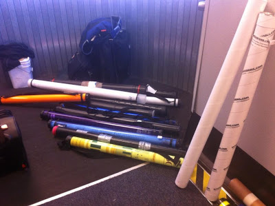 Poster tubes stacked at the passage way right off the plane.