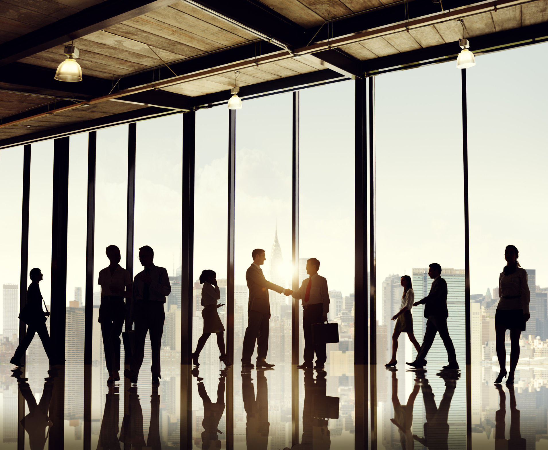 Yes, this is a stock photo. This image shows business people shaking hands, in a beautiful office, with gorgeous views. You have seen this somewhere, and it's a fantastic image. But should you use it in your company's marketing material ? Photo by Rawpixel | Getty Images