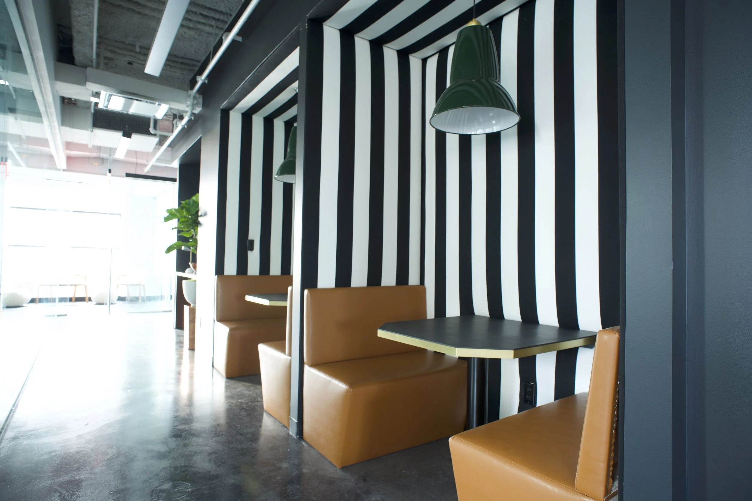 Bond Collective also provides conference rooms, phone booths, production studio, and recording booths.