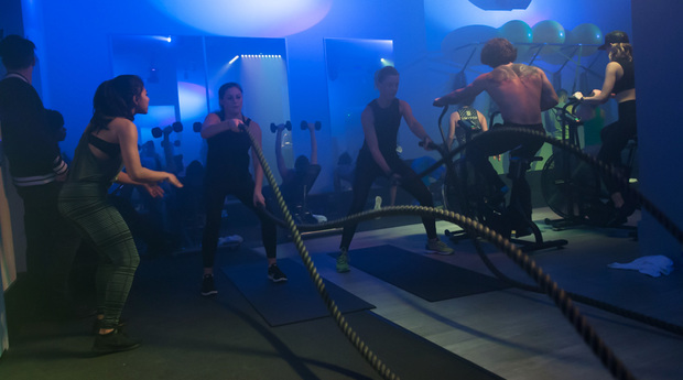 Fitness class under blue lights at Switch Playground