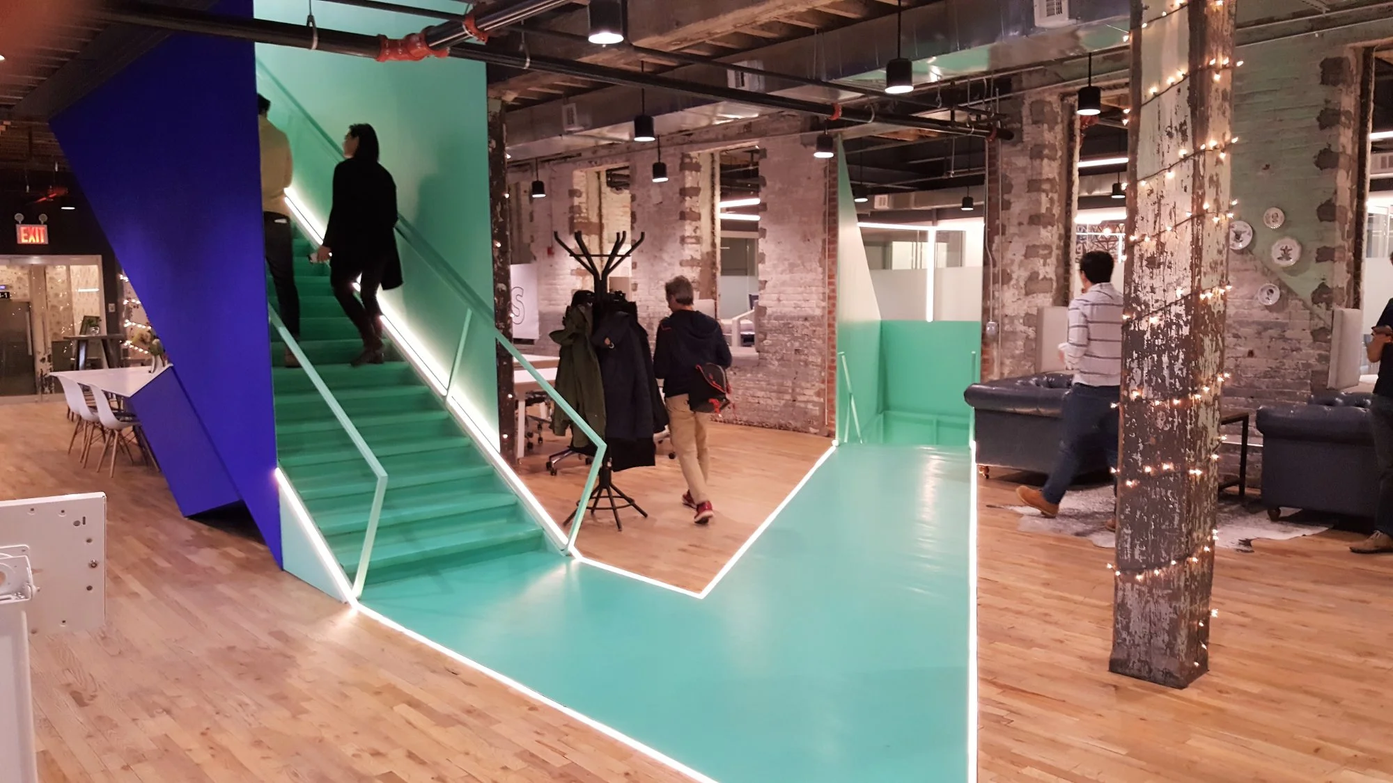 People walking upstairs at an open coworking space