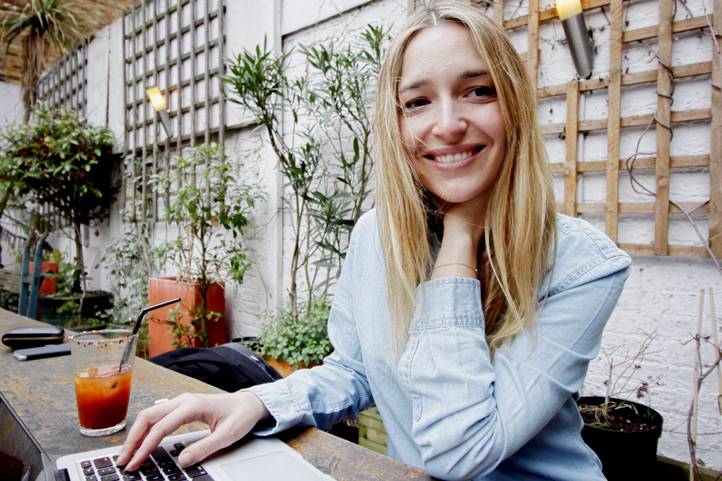 Woman working outside at a restaurant