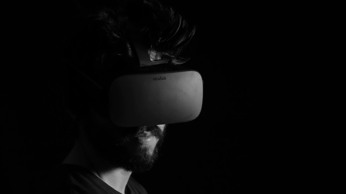 dark image of man wearing virtual reality headset
