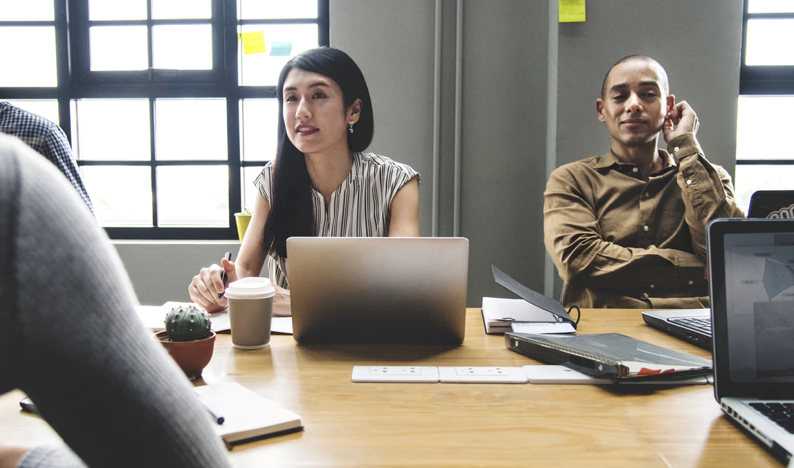 business team meeting around a large conference table