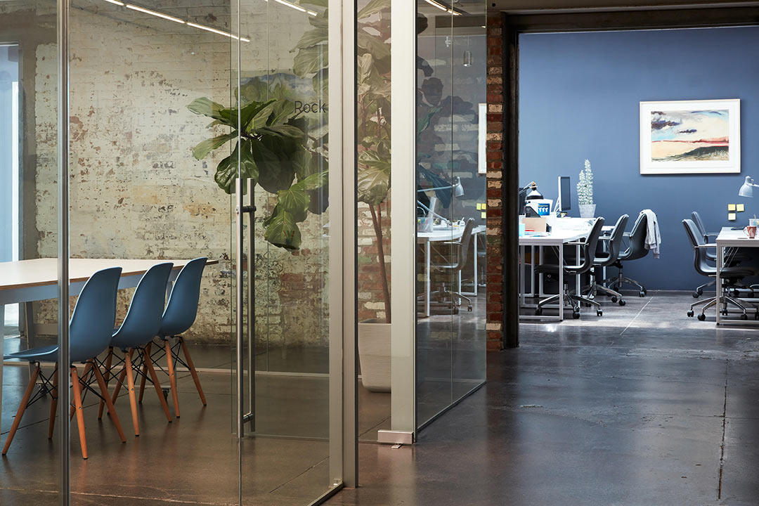 two functional working spaces within a shared office space
