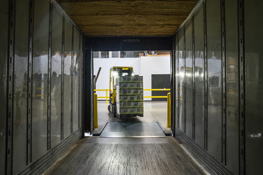 forklift moving items into a moving truck during an office move