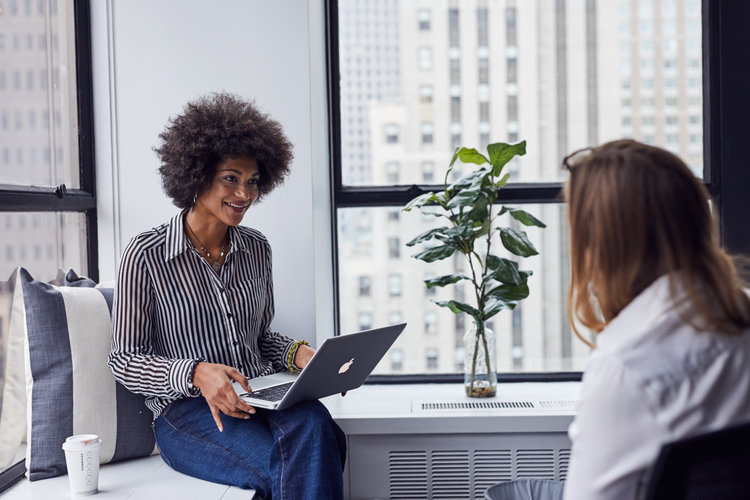 two women working together in a coworking space